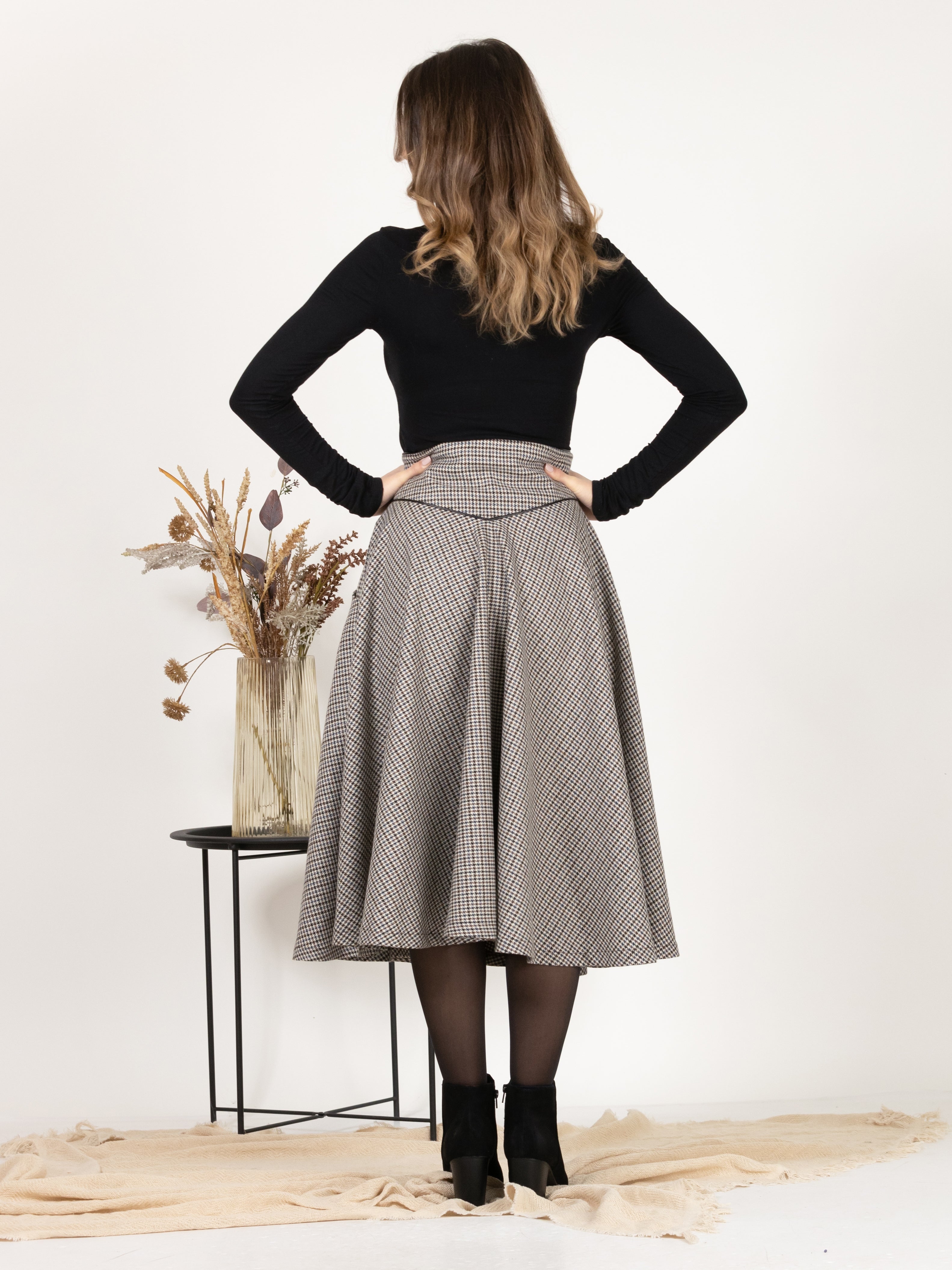 Back view emphasizing the retro-inspired design of Wool Midi Flare Skirt with High Waist in Houndstooth Pattern