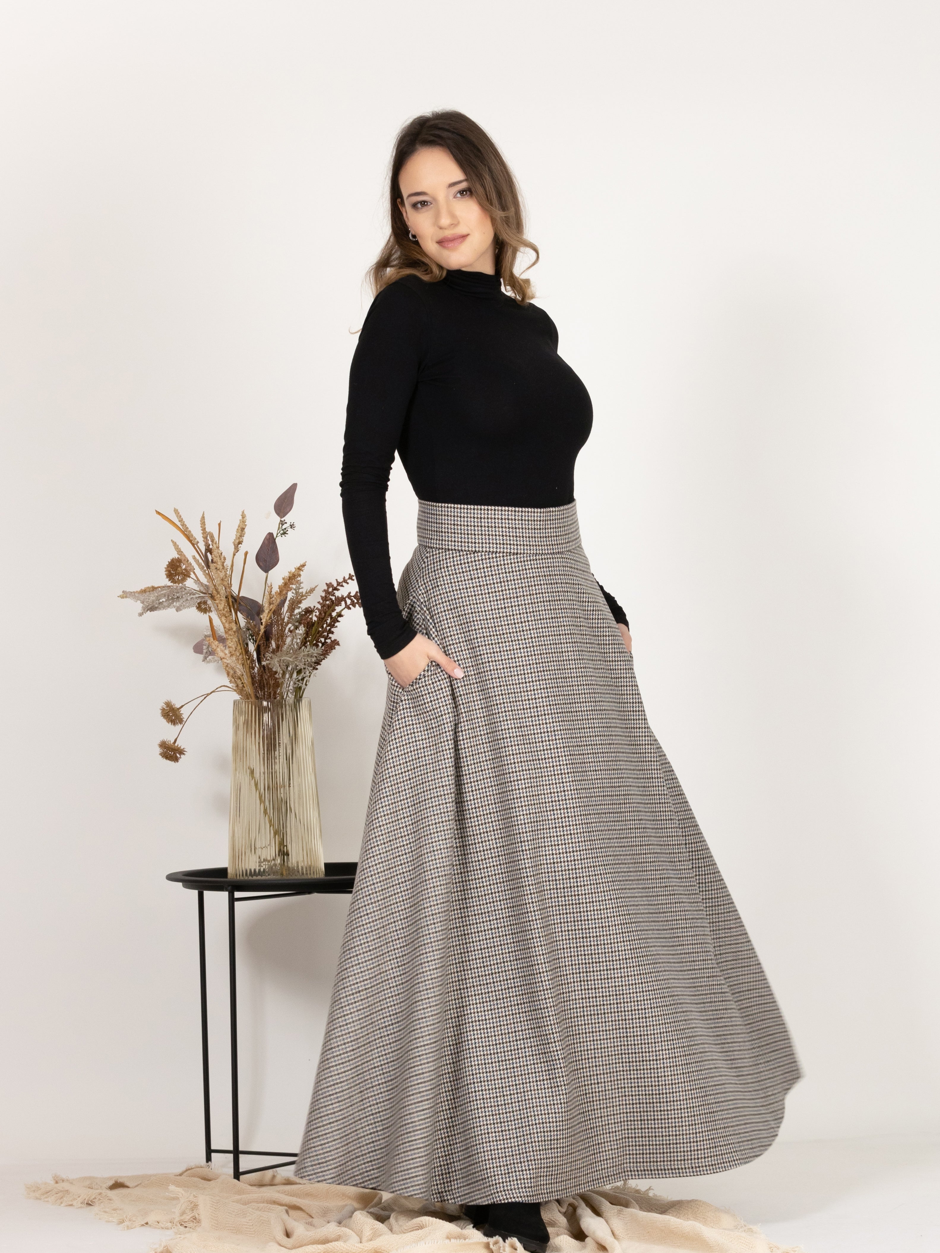 Front view of Wool Maxi A-Line Skirt with Pockets in Houndstooth Pattern, showcasing A-line silhouette for a flattering fit.