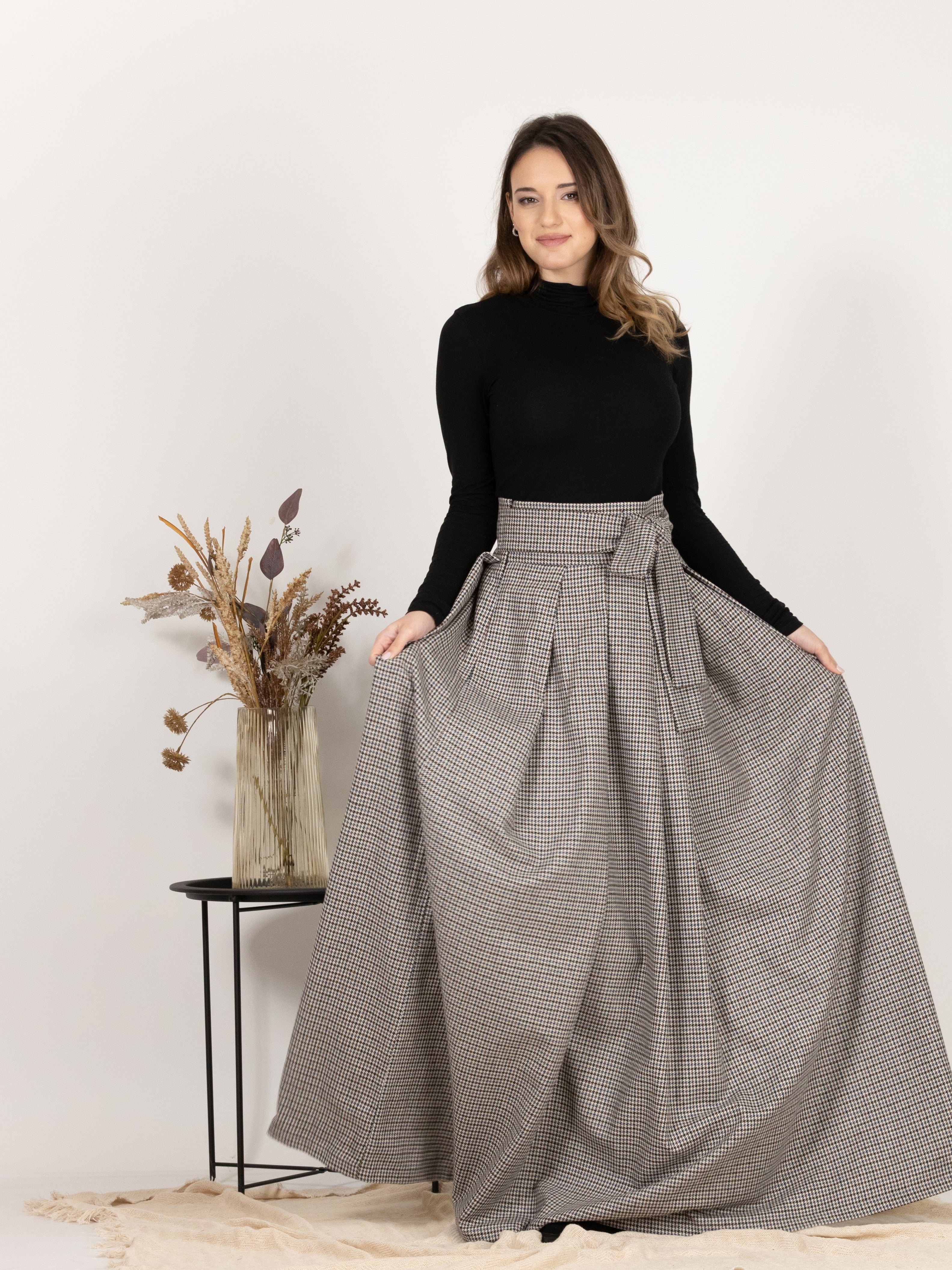 Front view of High Waisted Wool Long Skirt with Bow in Houndstooth Pattern, showcasing the maxi length and A-line silhouette for a flattering fit.