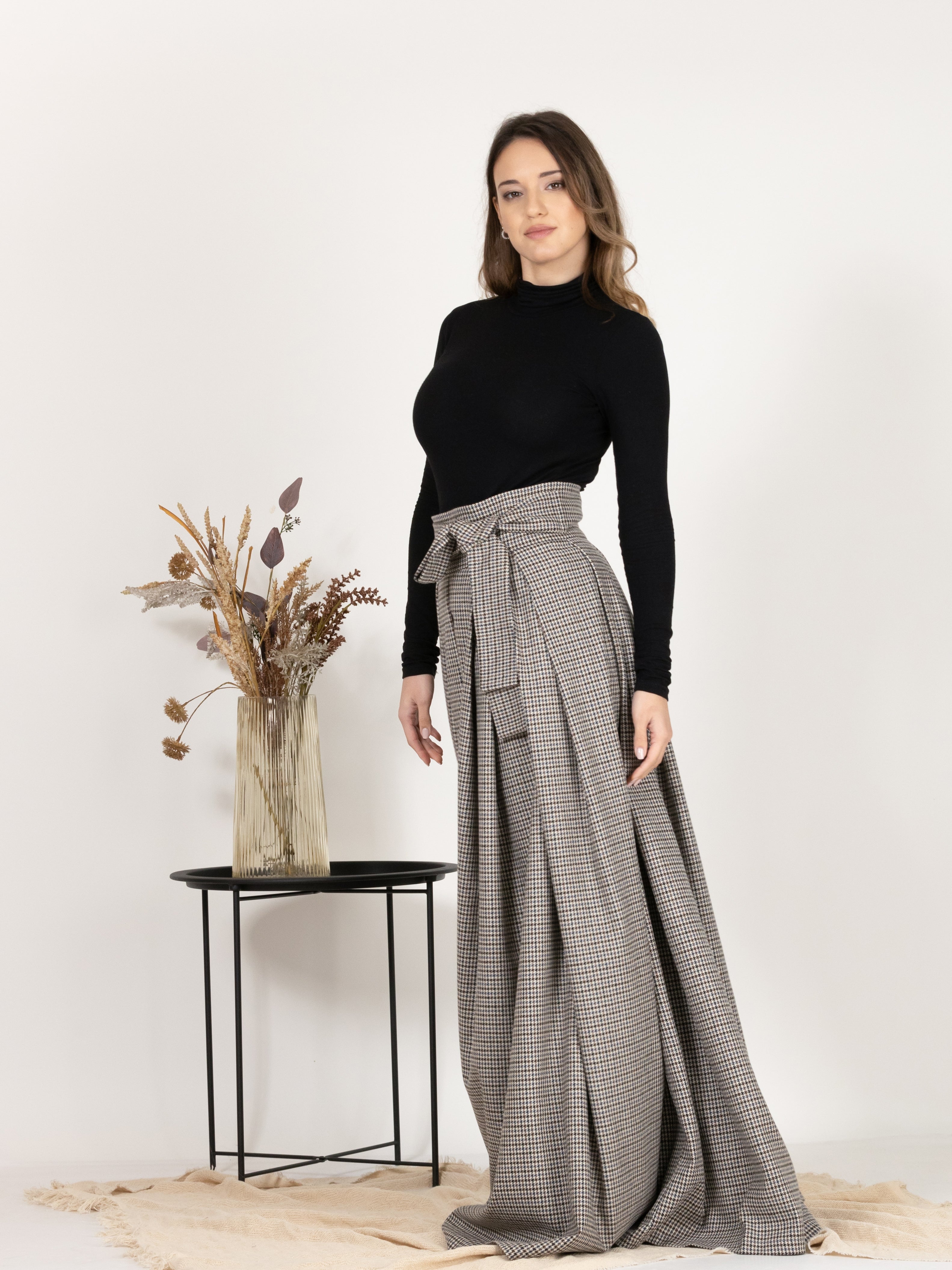 Side profile of High Waisted Wool Long Skirt with Bow in Houndstooth Pattern, highlighting the maxi length