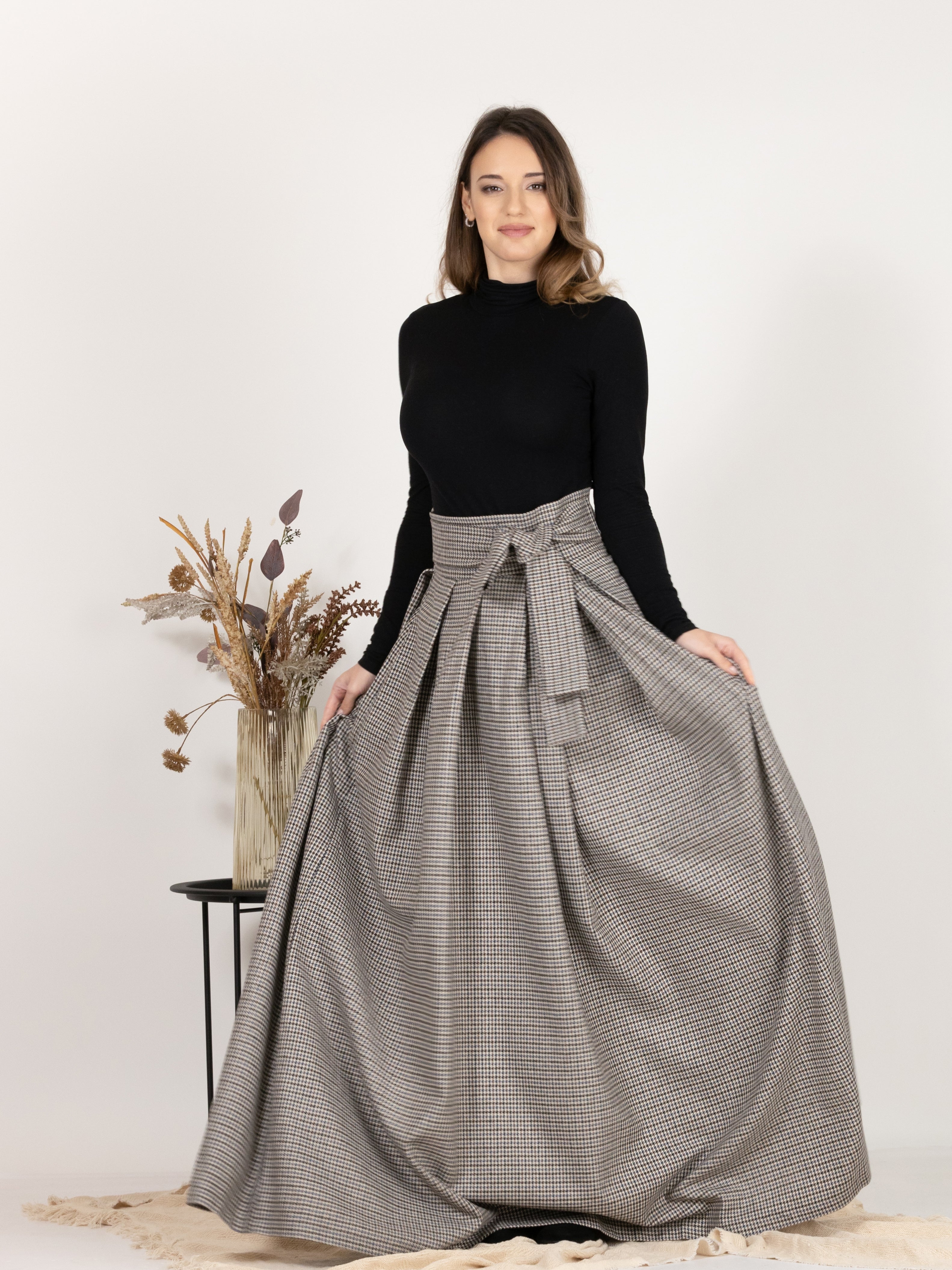 Front view of High Waisted Wool Long Skirt with Bow in Houndstooth Pattern, showcasing the beautiful bow detail on the waist.