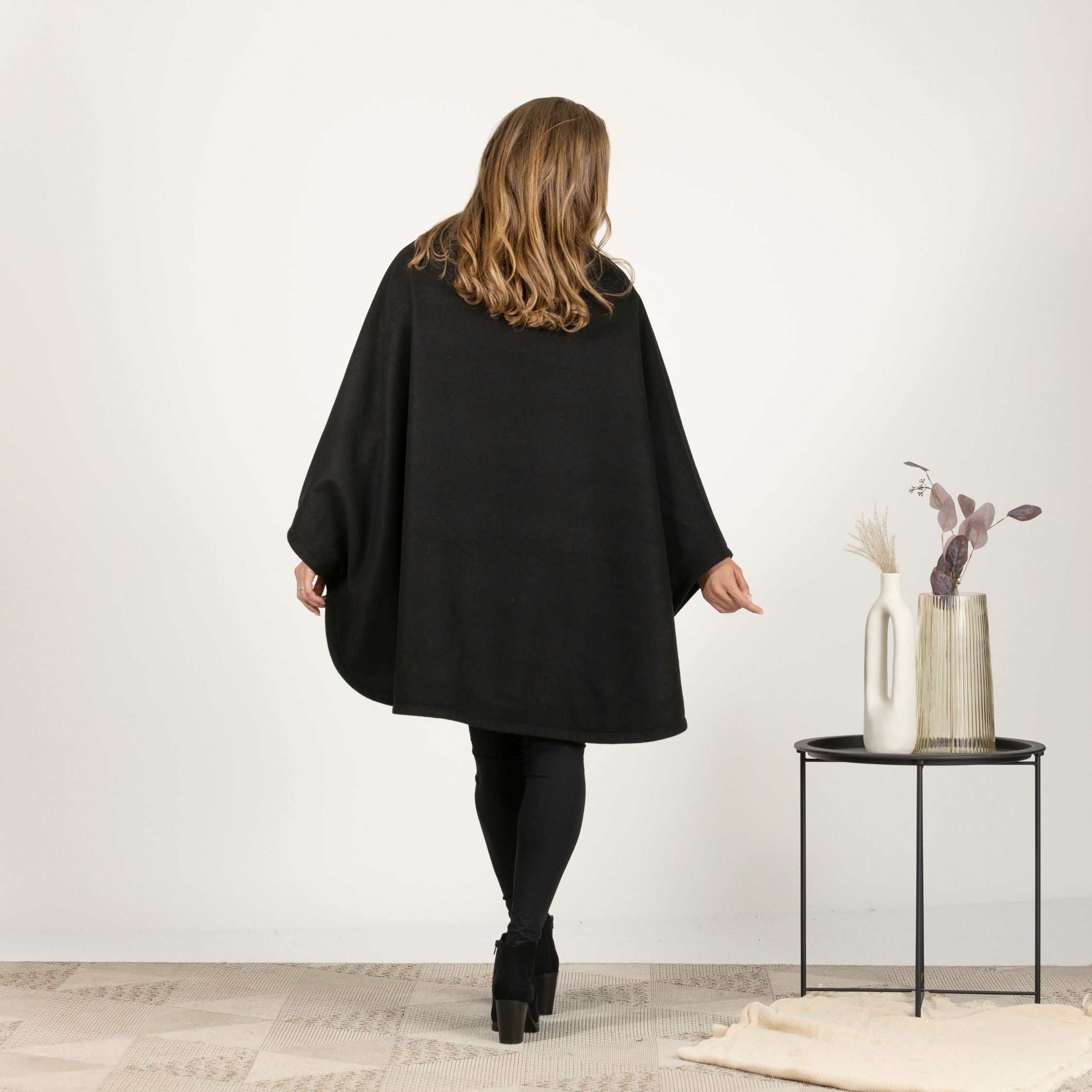 Back view of Oversized Wool Poncho Coat highlighting relaxed fit