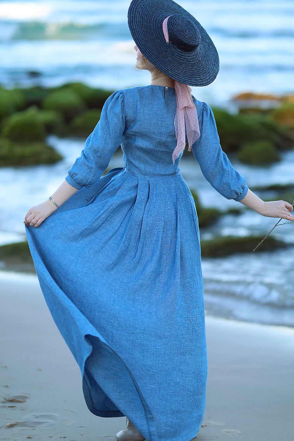 Back view of Natural blue linen maxi dress with long sleeves