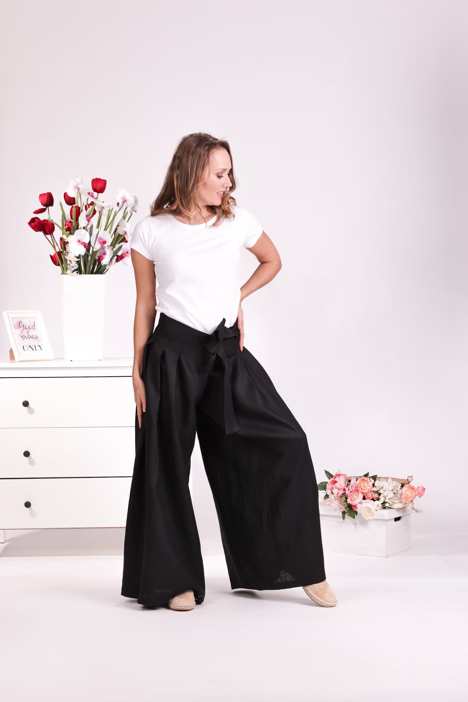 Relaxed dark linen trousers with bow detail