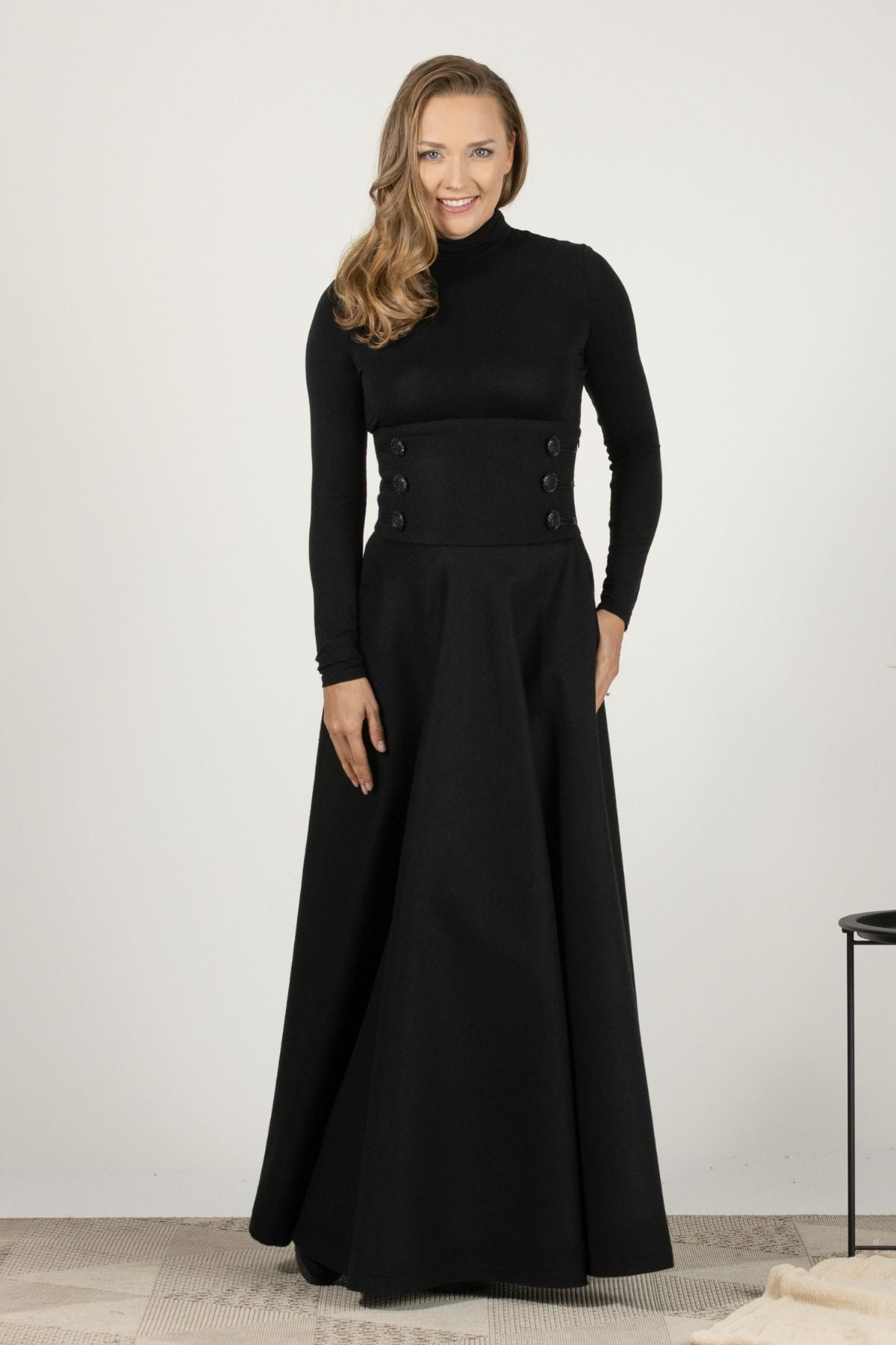 High-waisted black wool maxi with timeless design