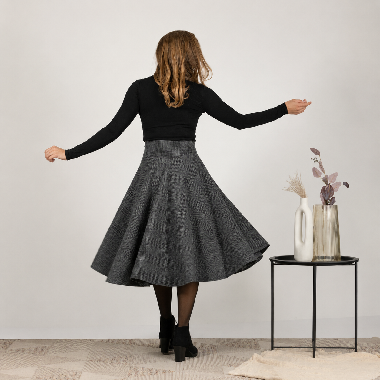Back profile highlighting the flow and side pockets of Wool Midi Flare Skirt