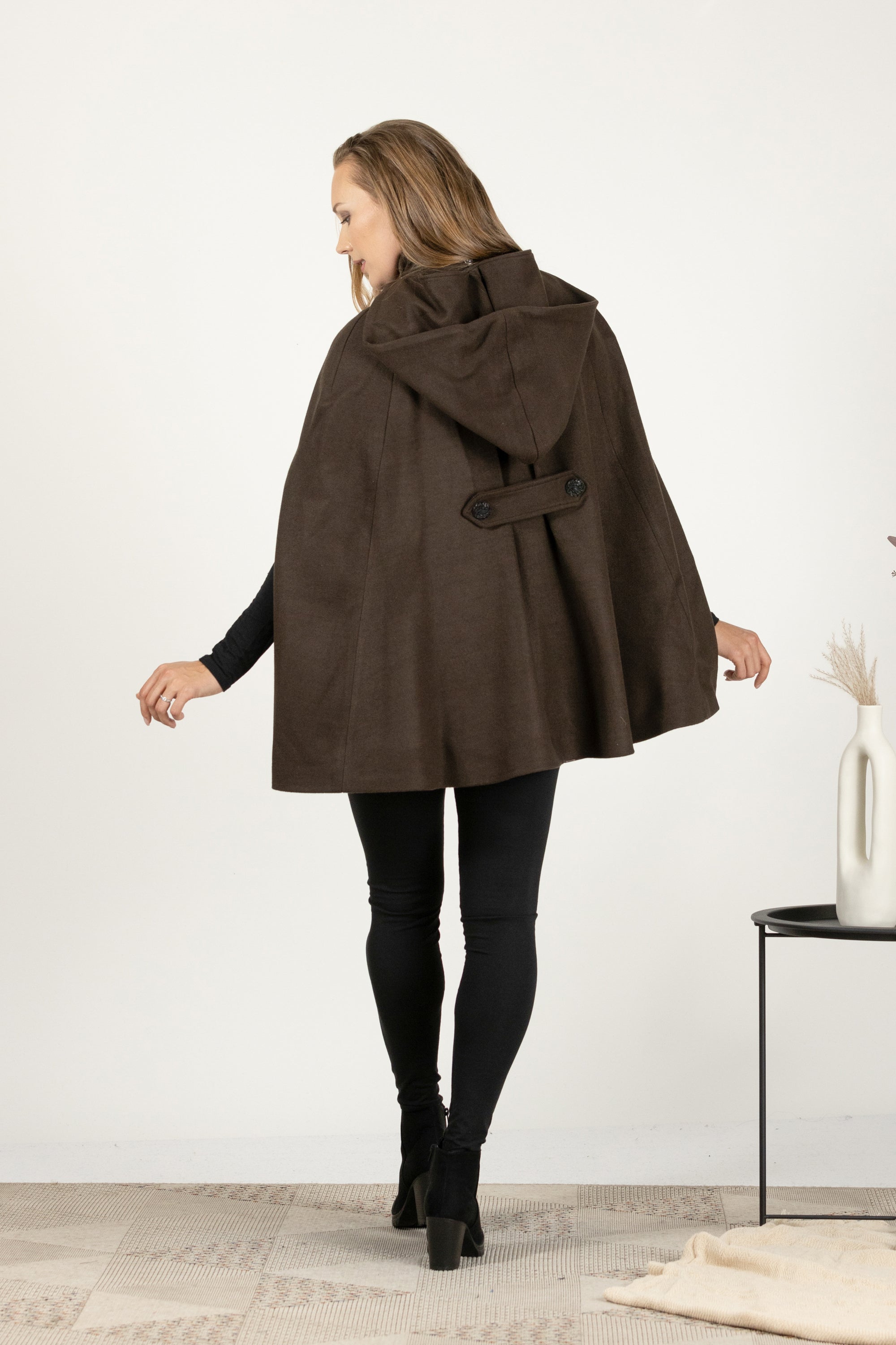 Back view of Mid-thigh brown cape coat with front pockets