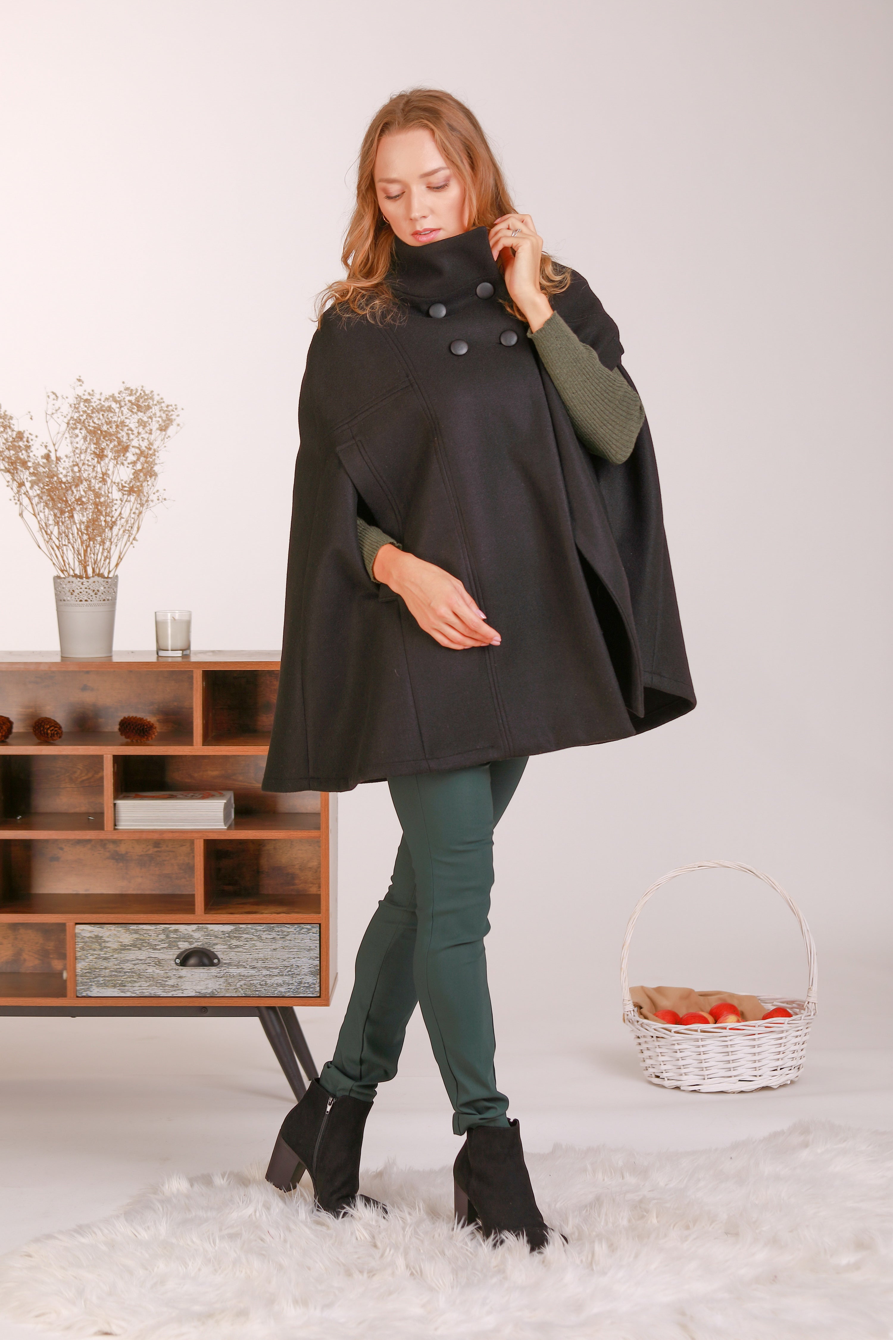 Stay warm in style with our Black Cape Coat - from NikkaPlace | Effortless fashion for easy living