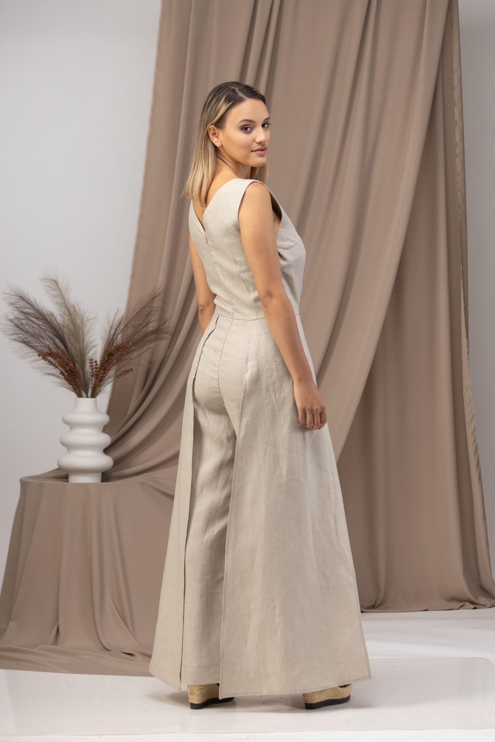 Stay cool and stylish in our Linen Maxi Jumpsuit with Flaps - from NikkaPlace | Effortless fashion for easy living