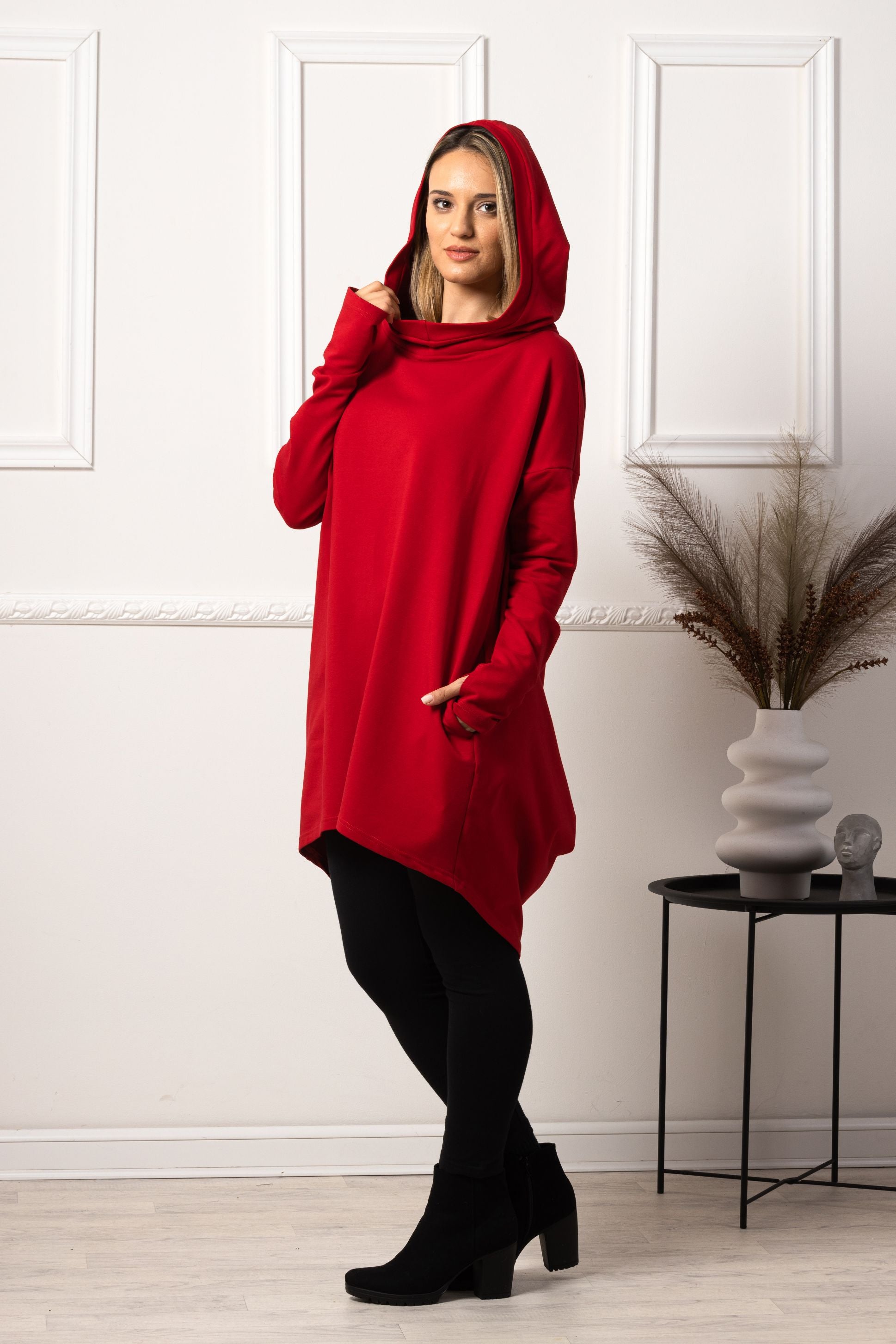 Side view of Red oversized hoodie with thumb holes
