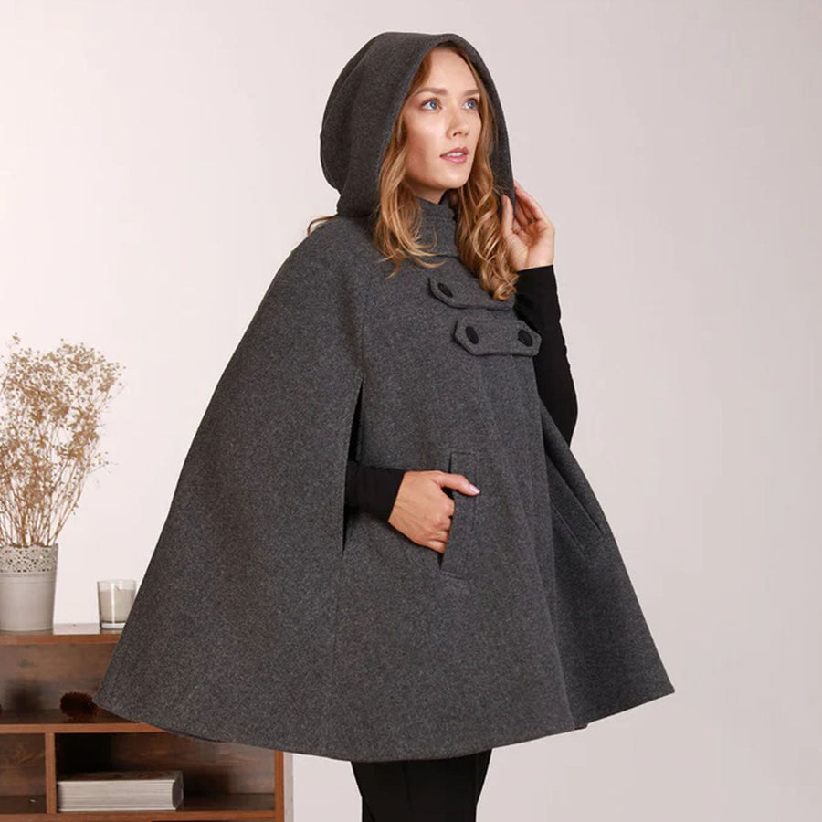 Woman in a hooded cape coat in winter