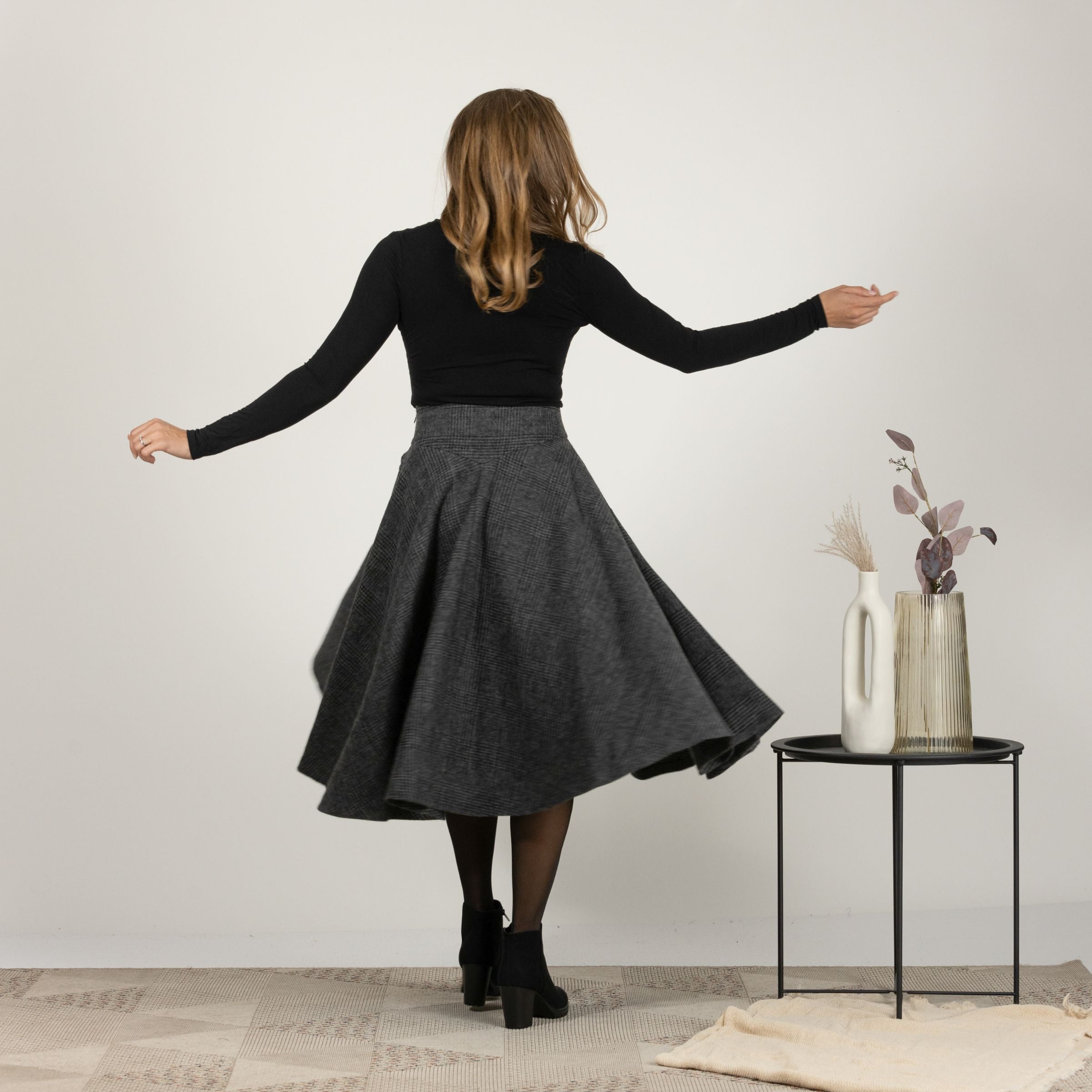 Back profile highlighting the flow and side pockets of Wool Midi Flare Skirt