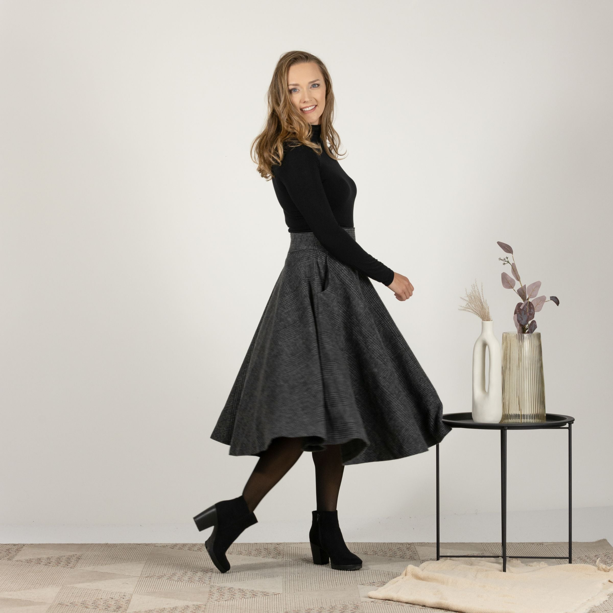 Side profile highlighting the flow and side pockets of Wool Midi Flare Skirt