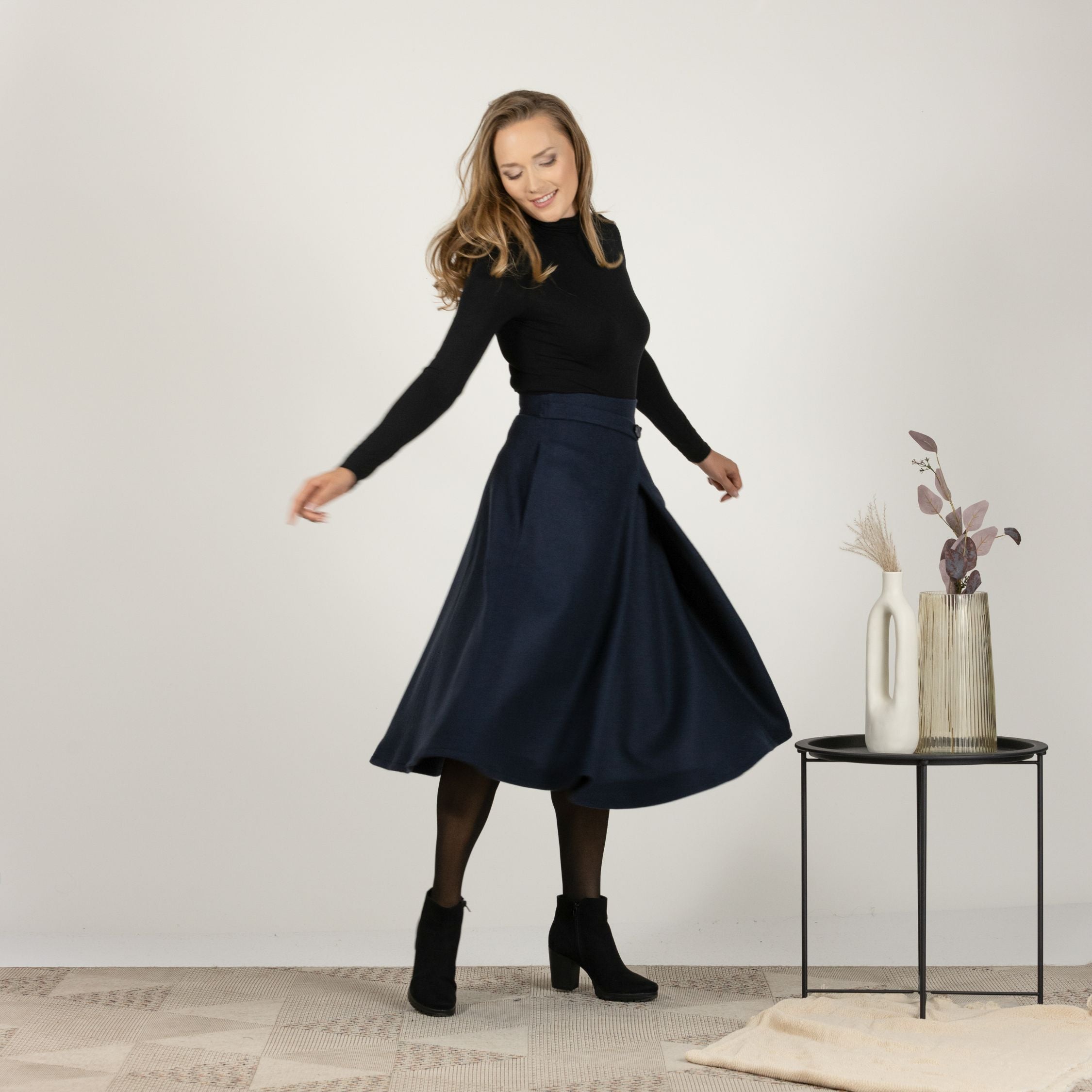 Side view of Wool Front Statement Skirt highlighting high waist and A-line silhouette