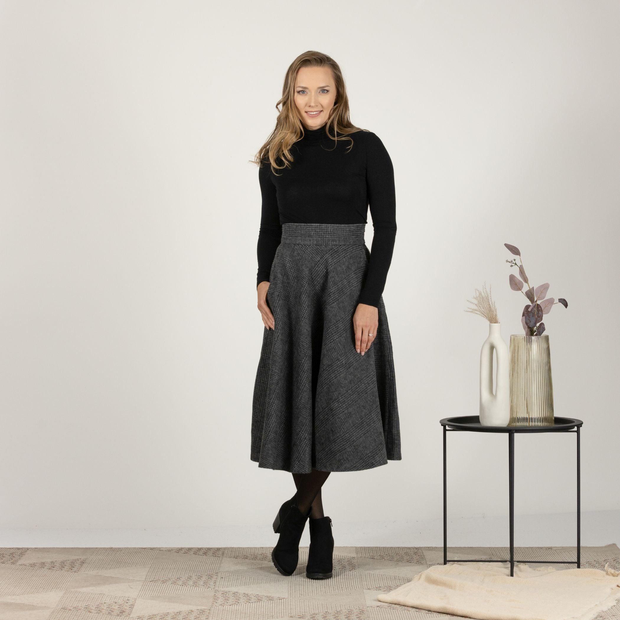 Front view of the Gray Plaid High Waisted Wool Midi Skirt, emphasizing the defined waist and elegant drape of the fabric.