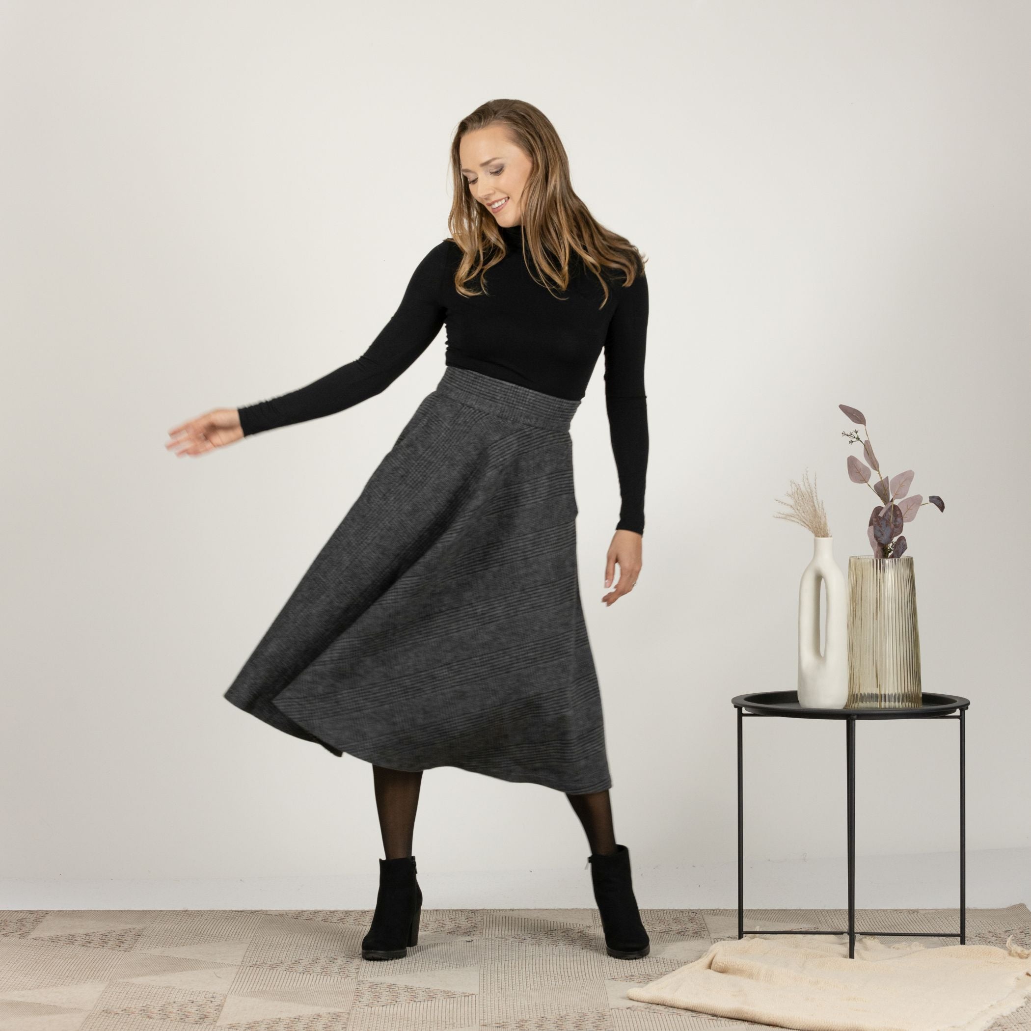 Full-length front view of the Gray Plaid High Waisted Wool Midi Skirt, highlighting the soft cool wool fabric and the timeless plaid design.