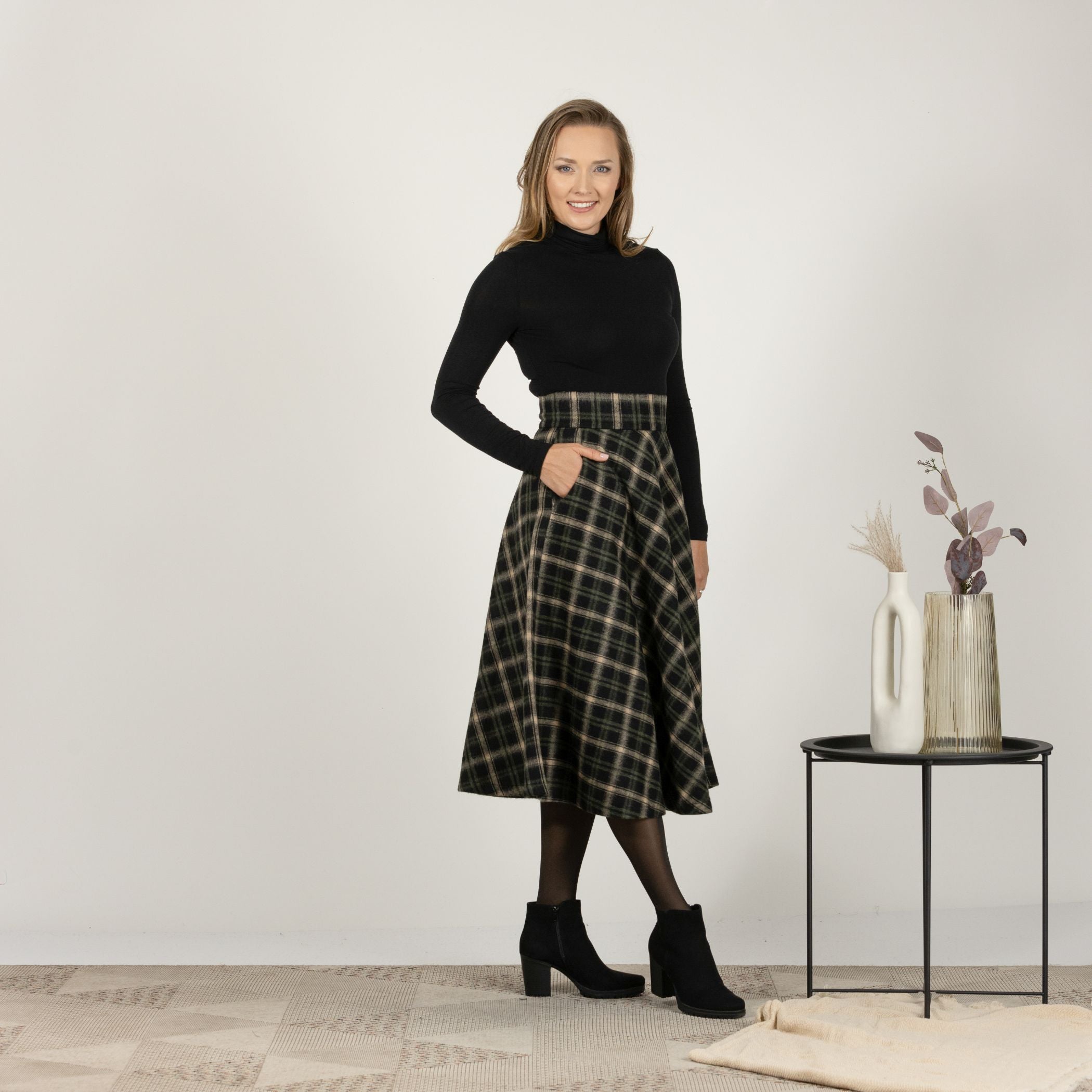 Front view of the Brown Plaid High Waisted Wool Midi Skirt, emphasizing the defined waist and elegant drape of the fabric.