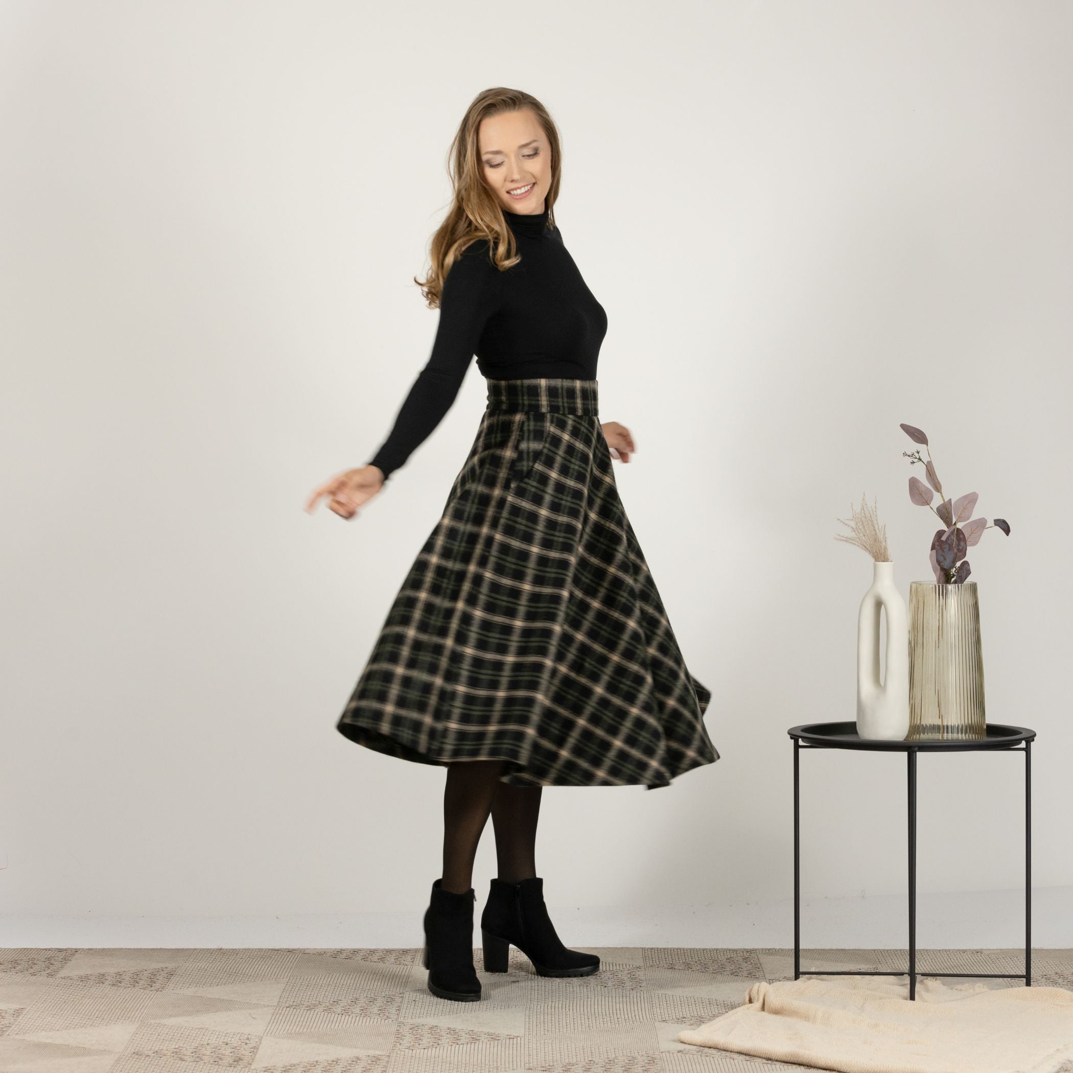 Side profile of the Brown Plaid High Waisted Wool Midi Skirt, highlighting the high waist and the sophisticated plaid pattern.