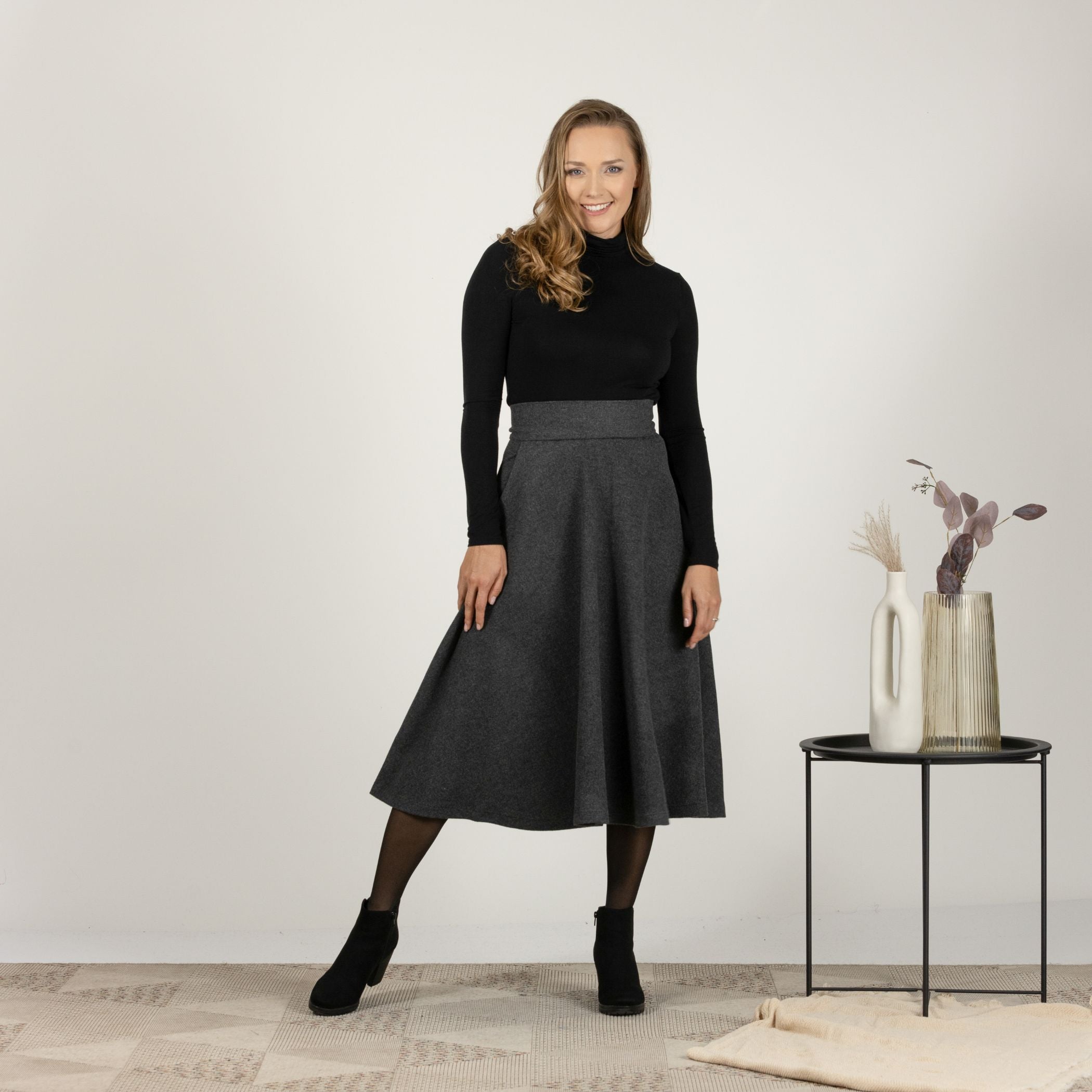 Front view of the Dark Gray High Waisted Wool Midi Skirt, showcasing the classic midi length and high-waisted silhouette for a flattering fit.