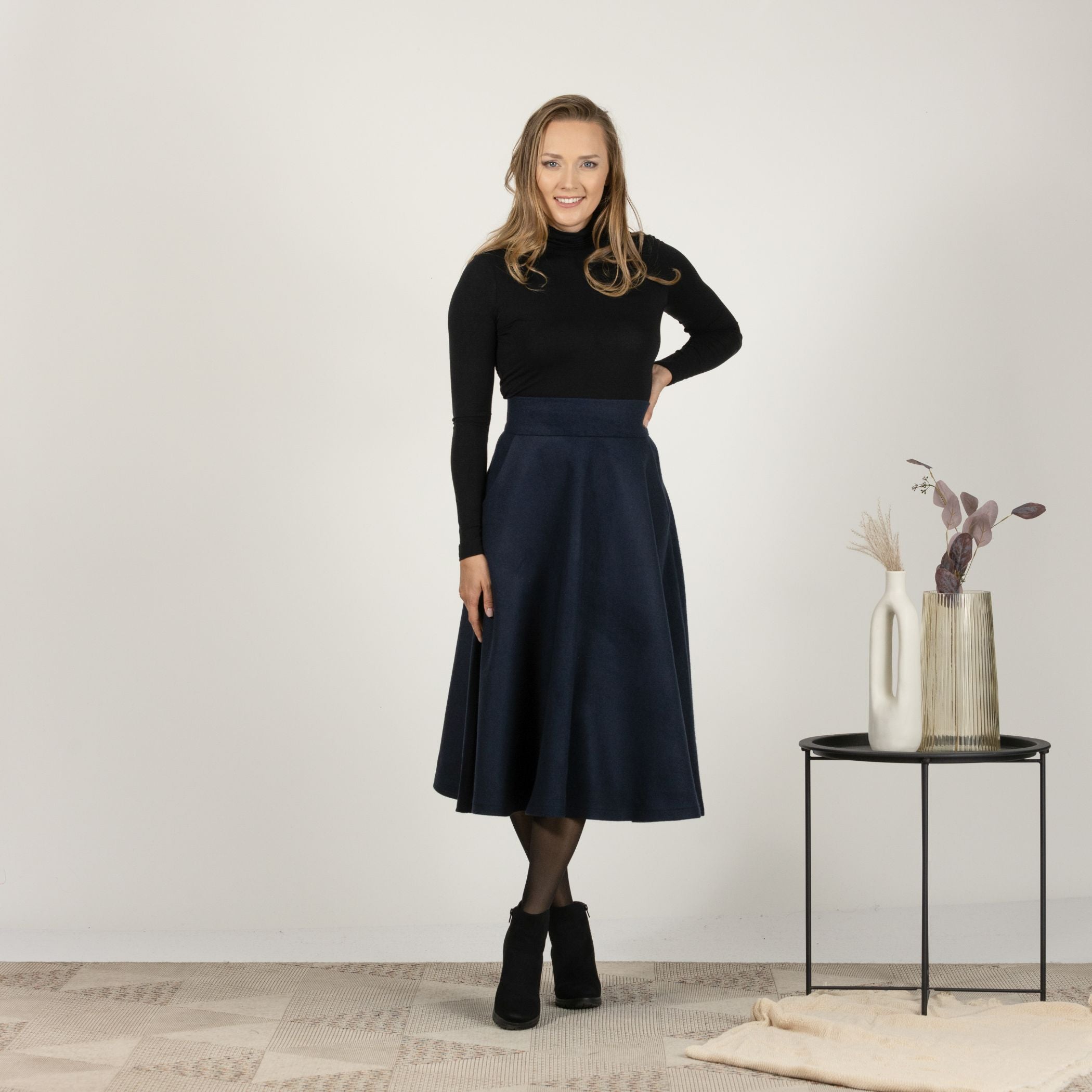 Front view of the Dark Blue High Waisted Wool Midi Skirt, showcasing the sleek midi length and high-waisted design for a flattering fit.