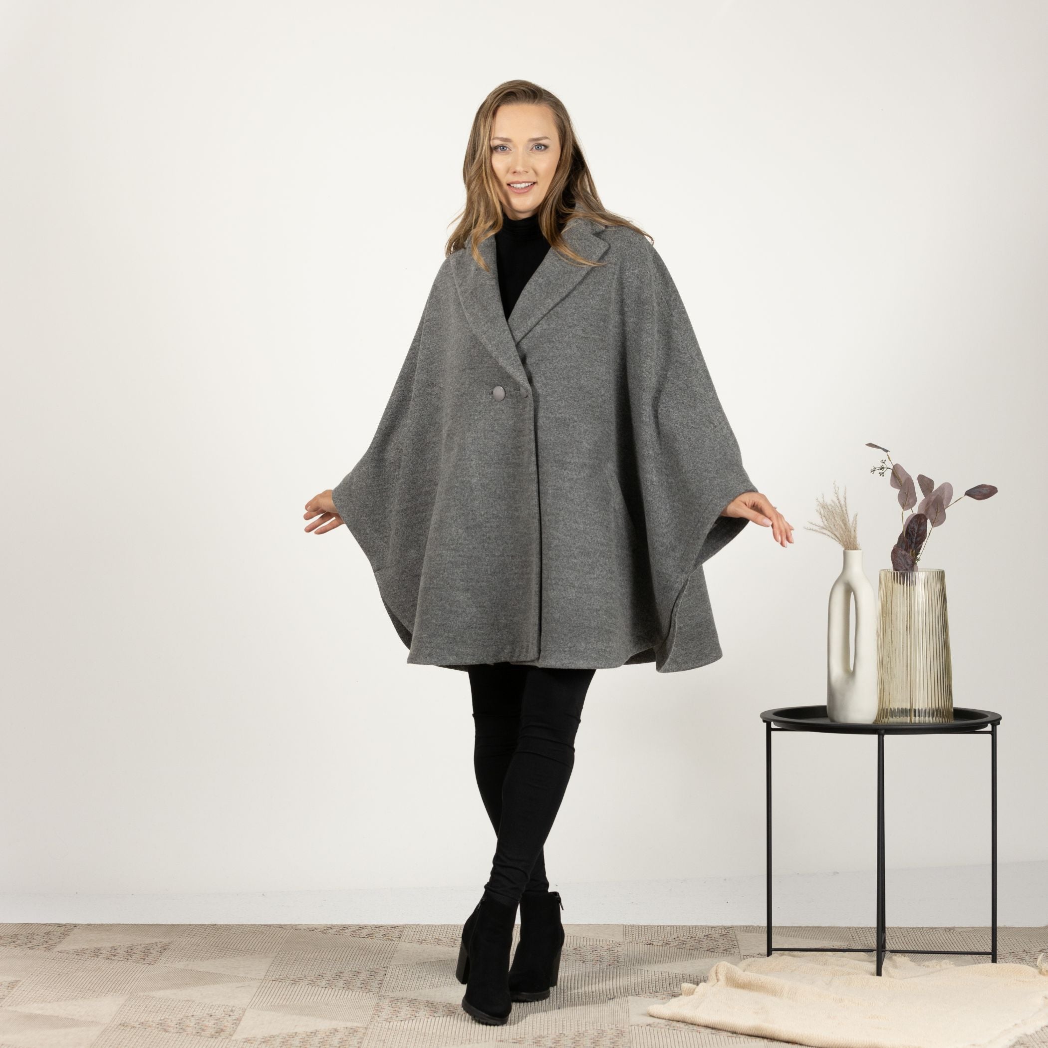 Front view of the Gray Collared Loose Cape Coat, showcasing the elegant lapel collar and cape-style design with a button closure.