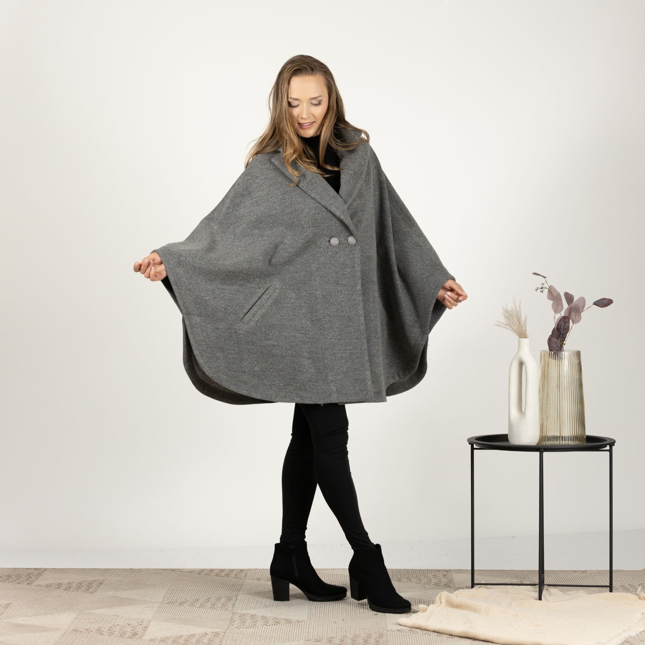 Close-up front view of the Gray Collared Loose Cape Coat, focusing on the sophisticated lapel collar and the soft, lined interior for added warmth.