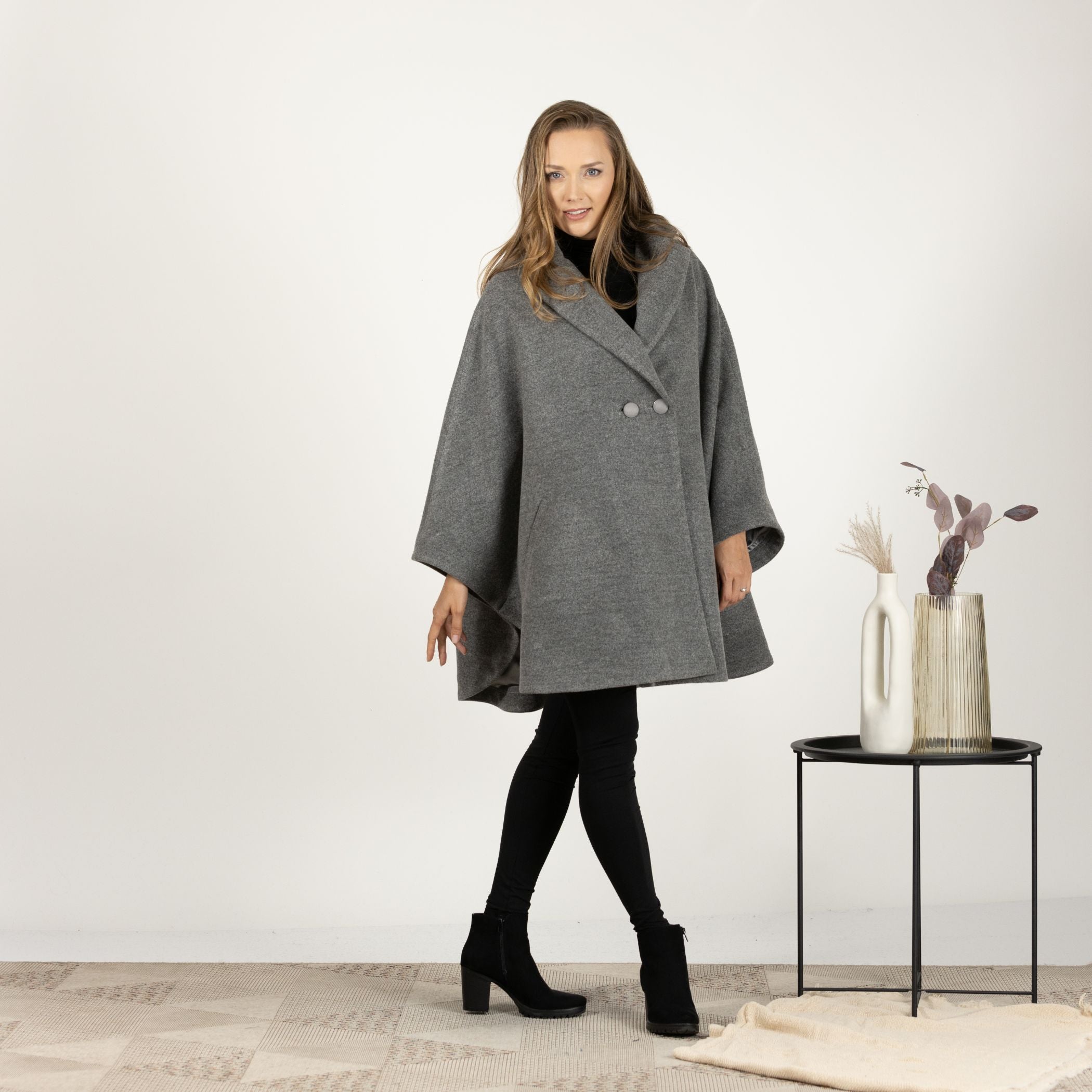 Front view of the Gray Collared Loose Cape Coat, emphasizing the practical front pockets and the chic, versatile design.