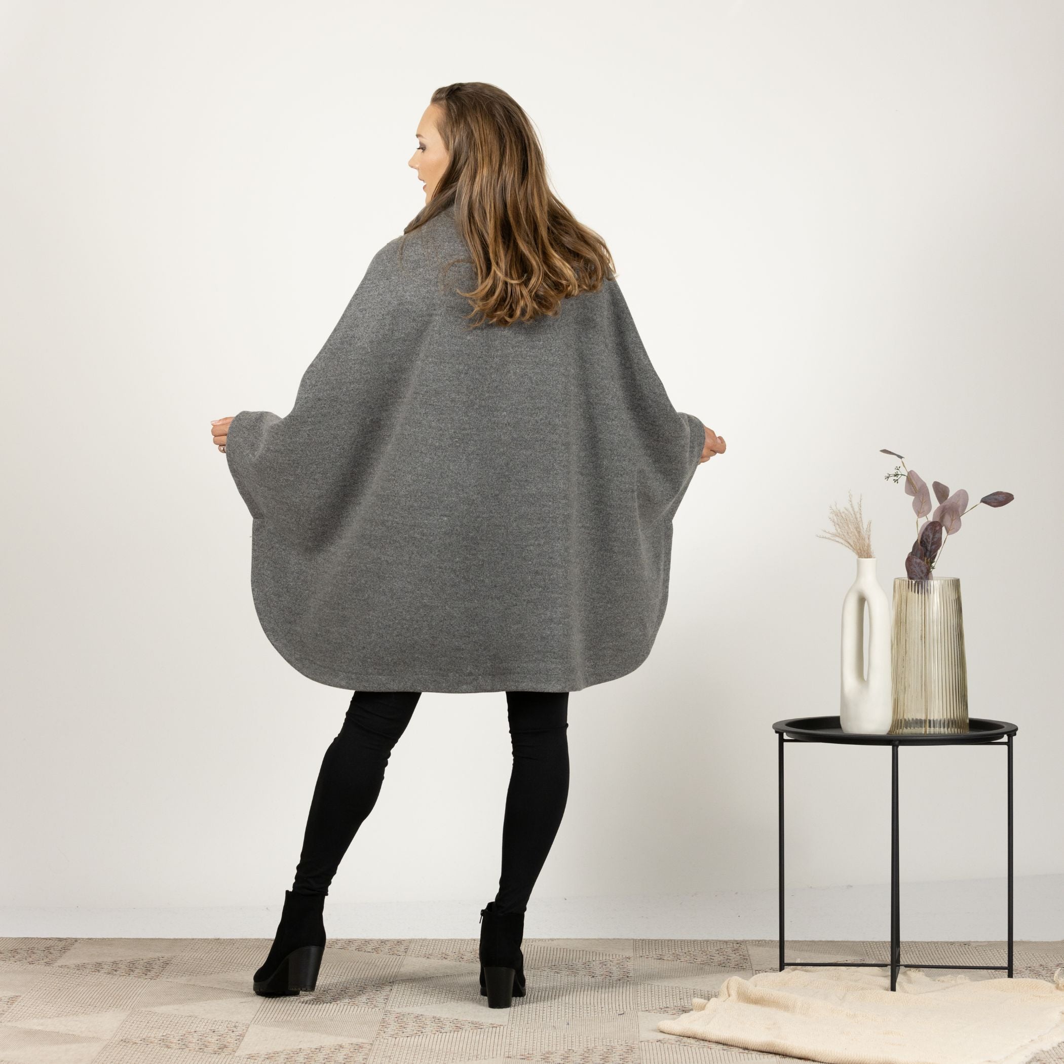 Back view of the Gray Collared Loose Cape Coat, emphasizing the seamless cape design and the relaxed fit for effortless style.