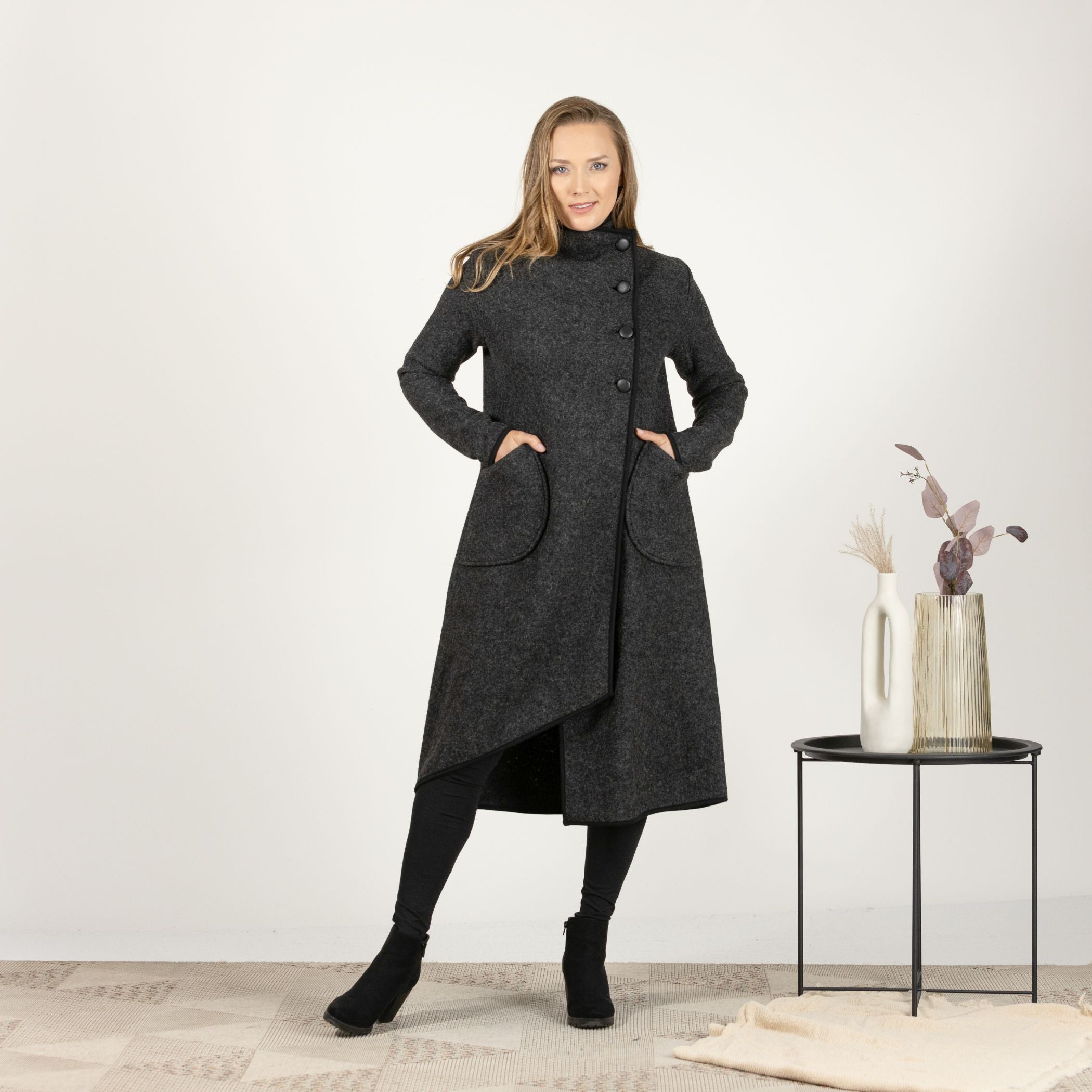 Front view of the Charcoal Boiled Wool Coat with Pockets, showcasing the classic design with an overlapping front and three-button closure.