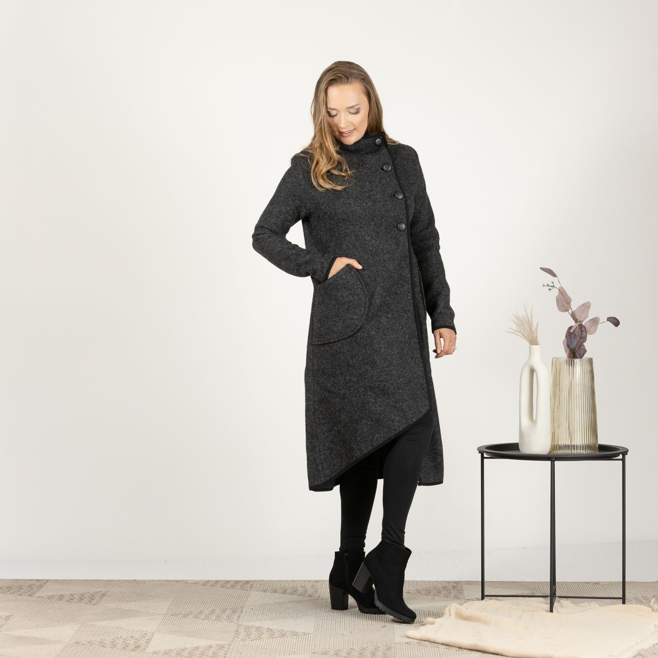 Close-up front view of the Charcoal Boiled Wool Coat with Pockets, focusing on the fine texture of the boiled wool and the secure button closure.