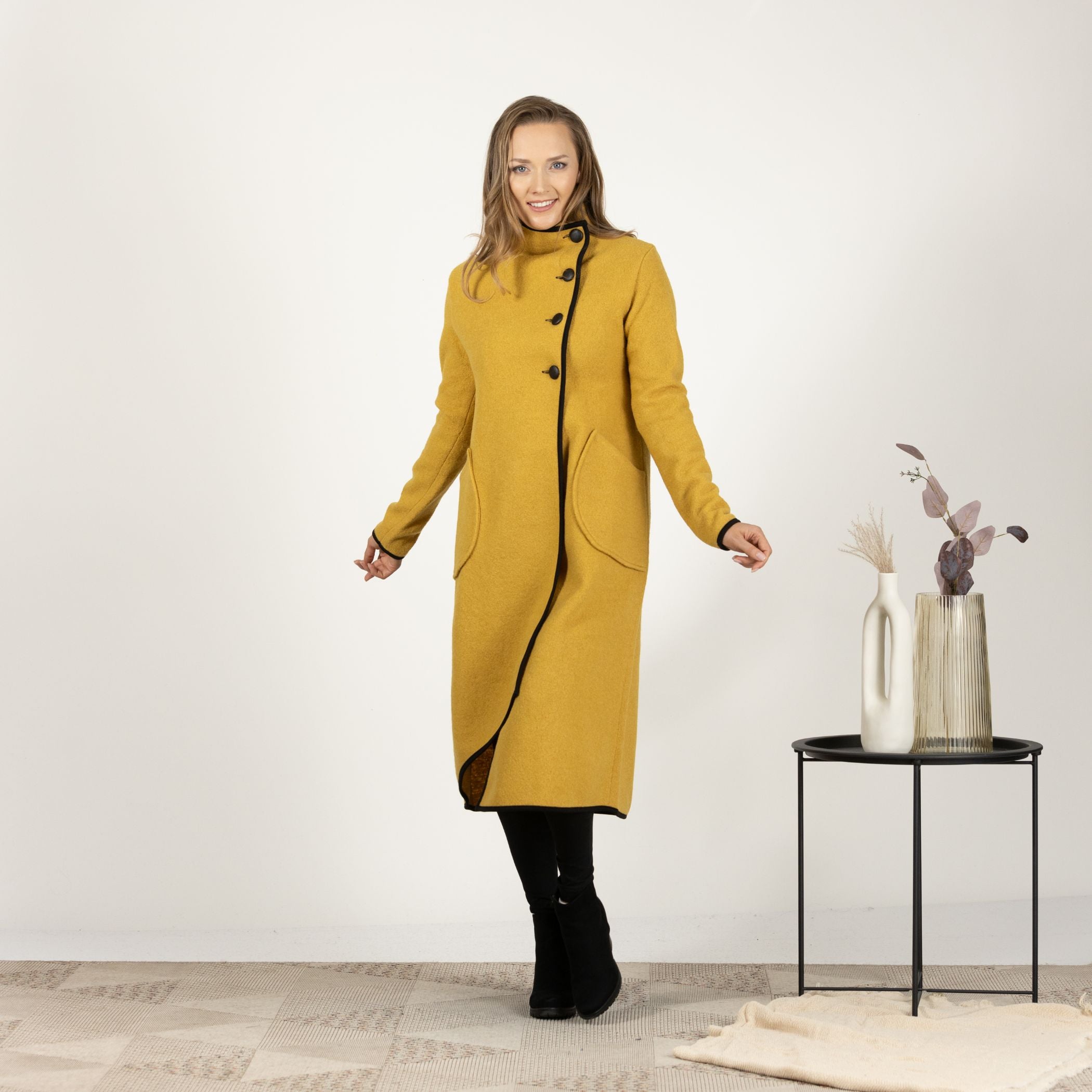 Close-up front view of the Mustard Boiled Wool Coat with Pockets, focusing on the rich texture of the boiled wool and the secure button closure.