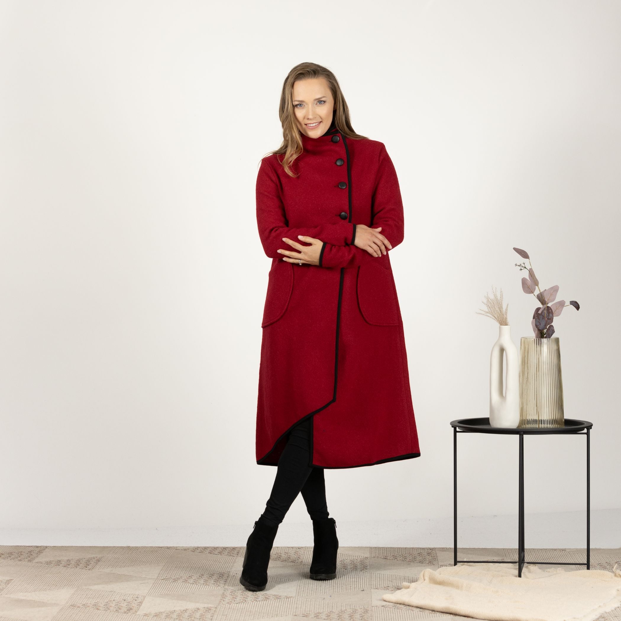 Close-up front view of the Raspberry Boiled Wool Coat with Pockets, focusing on the rich texture of the boiled wool and the secure button closure.