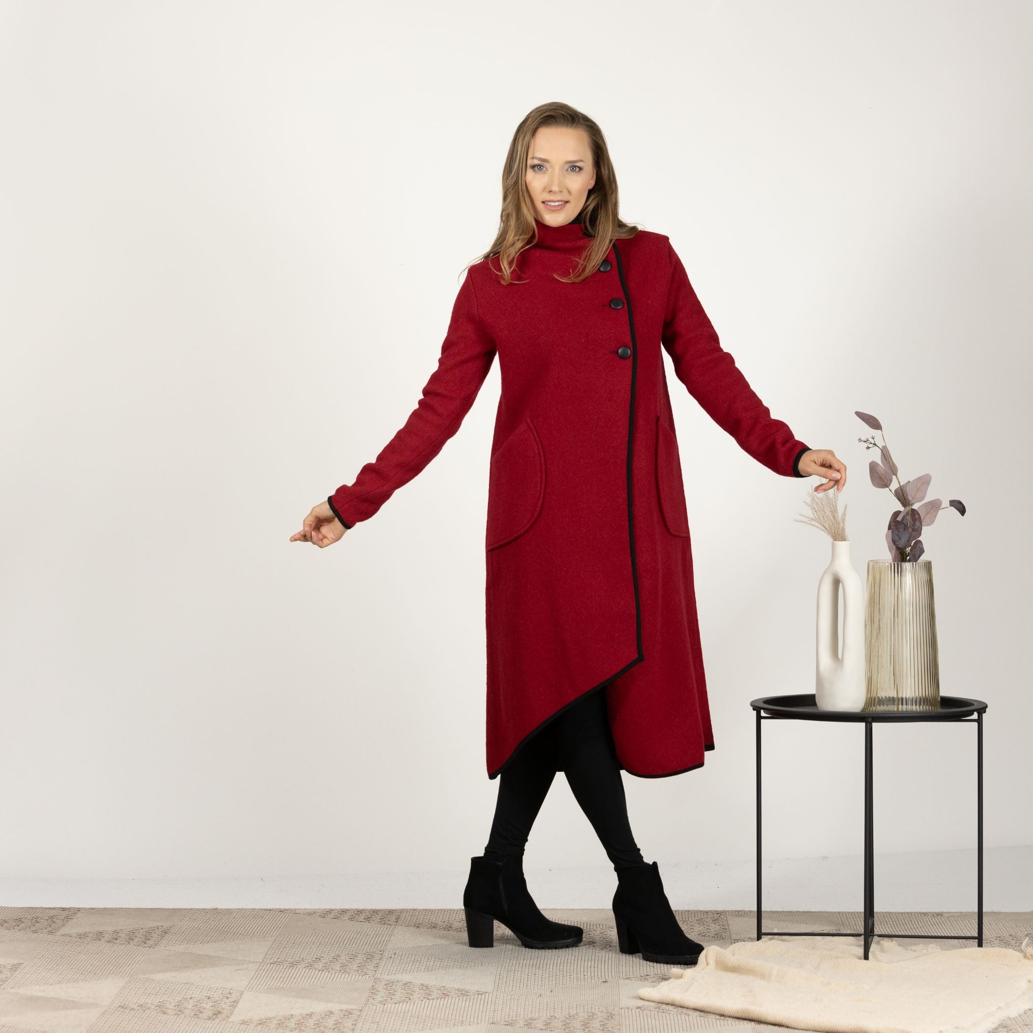 Front view of the Raspberry Boiled Wool Coat with Pockets and the high collar turned up, emphasizing the cozy and stylish design.