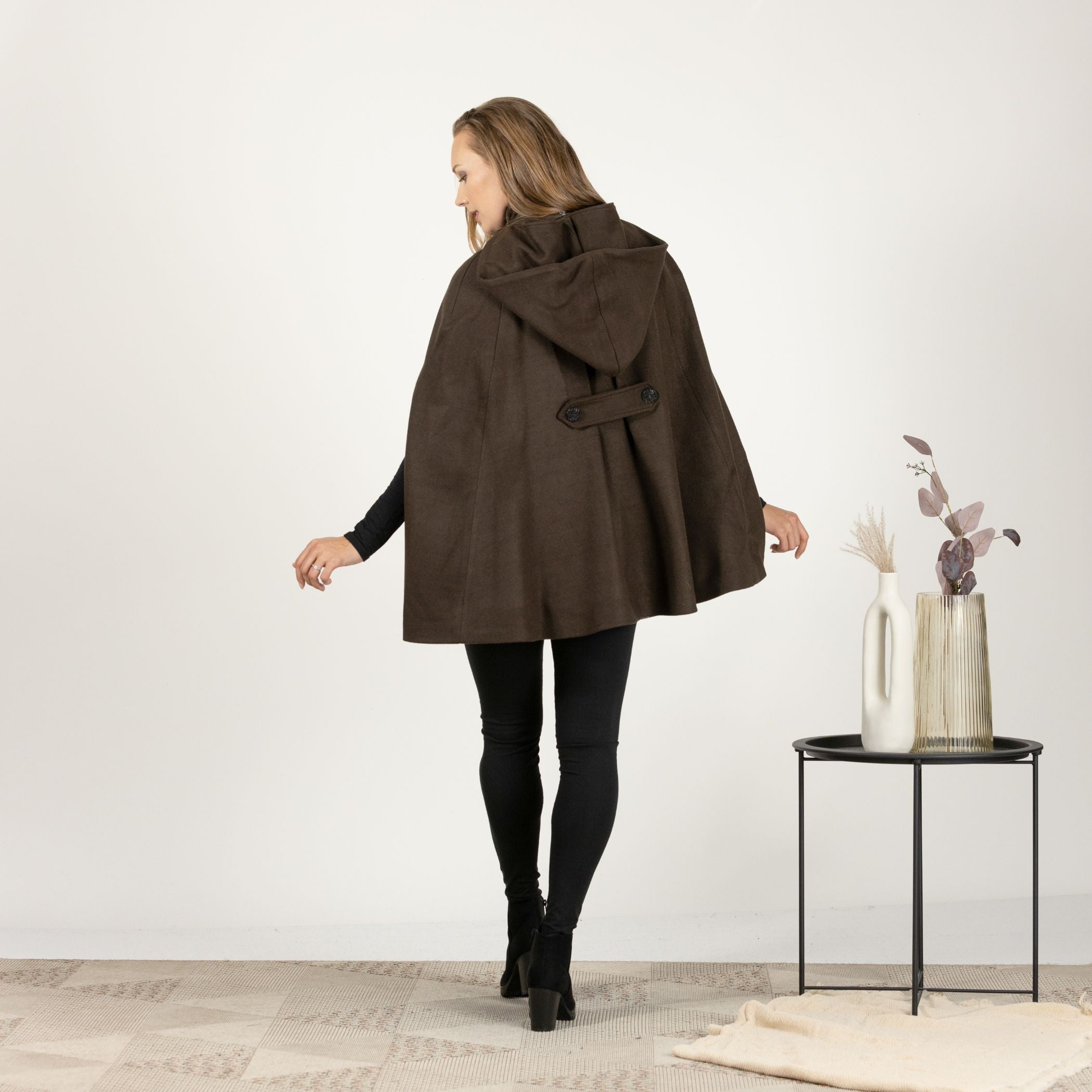 Back view of the Brown Hooded Wool Cape Coat, emphasizing the seamless cape design and the classic mid-thigh length for a stylish look.