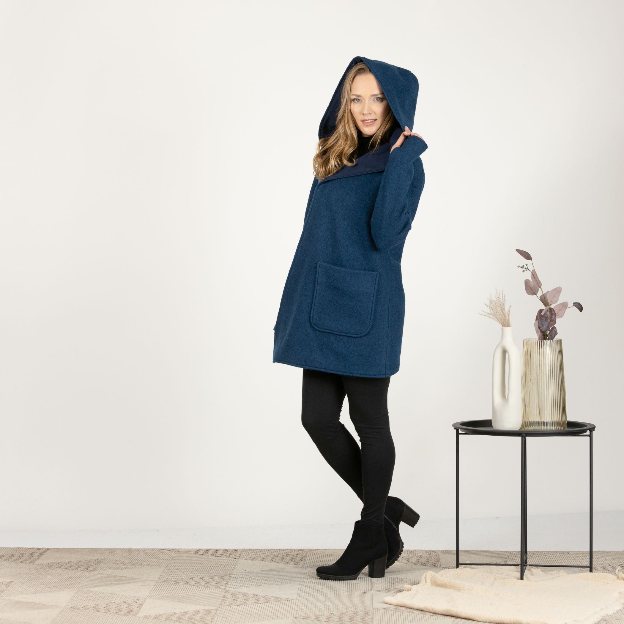 Side view of the Prussian Blue Hooded Wool Cardigan, featuring the relaxed fit and cozy hood for a stylish, comfortable look.