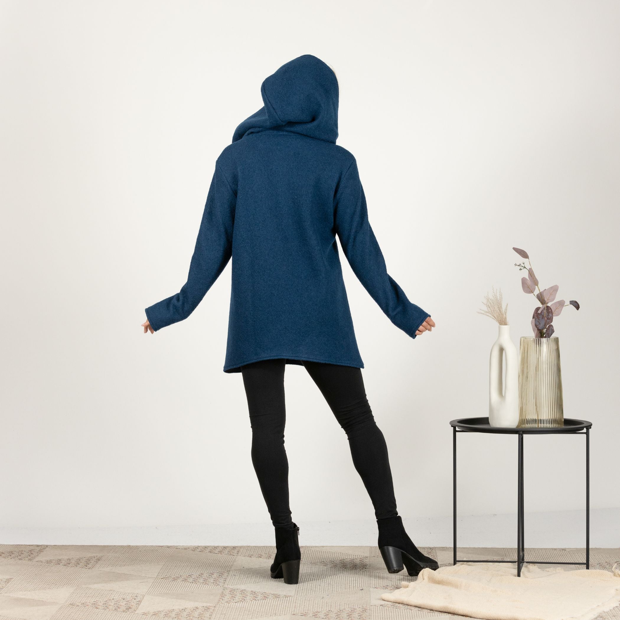 Back view of the Prussian Blue Hooded Wool Cardigan, showcasing the elegant design with a full-length hood and clean lines.