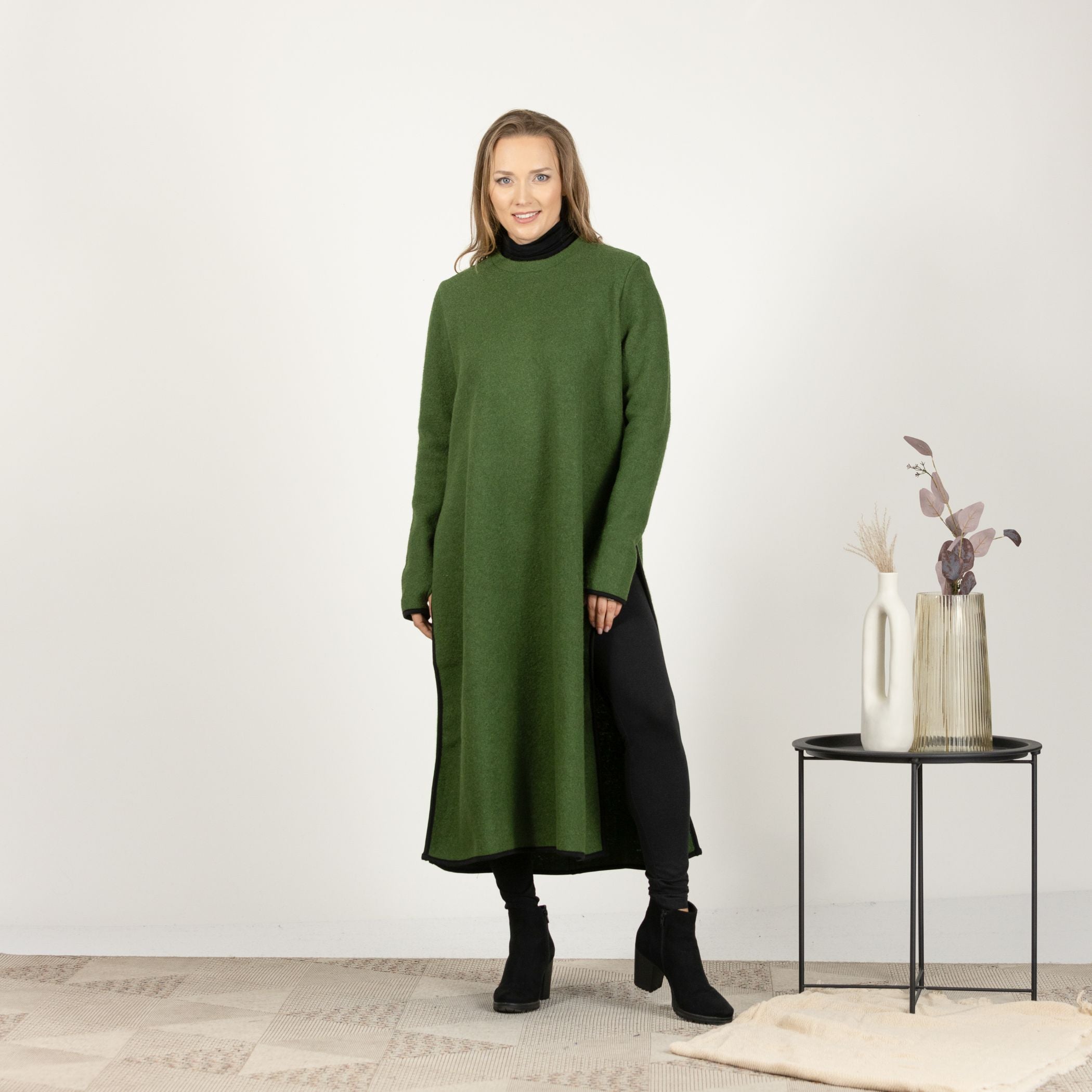 Full-length front view of the Forest Green Wool Winter Sweater Dress, highlighting the straight silhouette and deep side slits