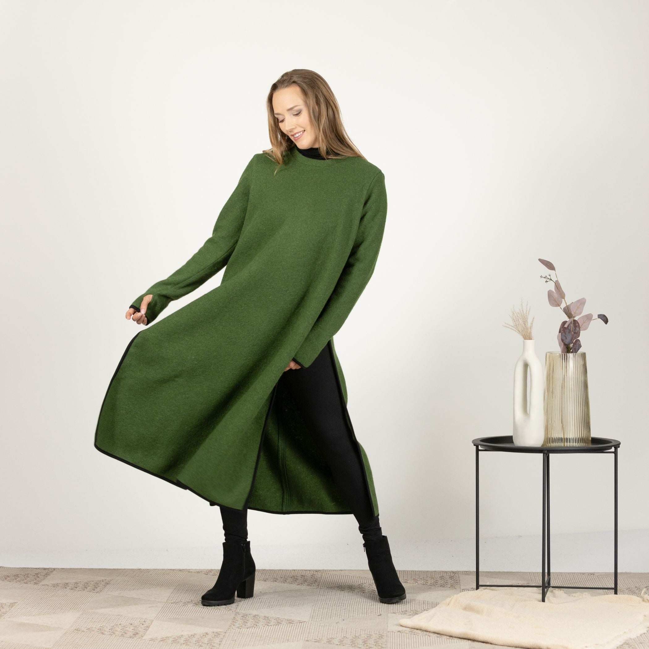 Front view of the Forest Green Wool Winter Sweater Dress, emphasizing the stylish side slits and the deep, sophisticated green color.