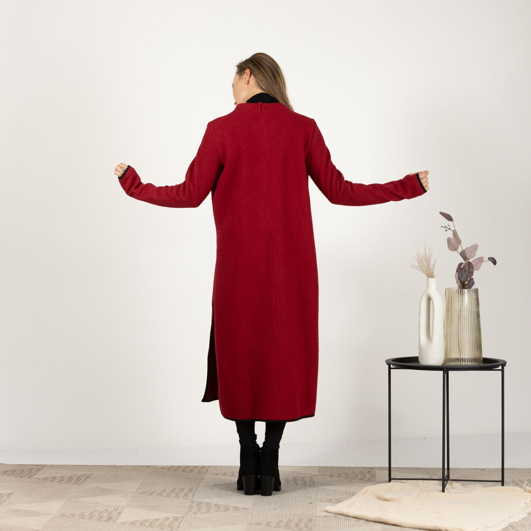 Back view of the Raspberry Wool Winter Sweater Dress, emphasizing the bold color and the classic, seamless silhouette.