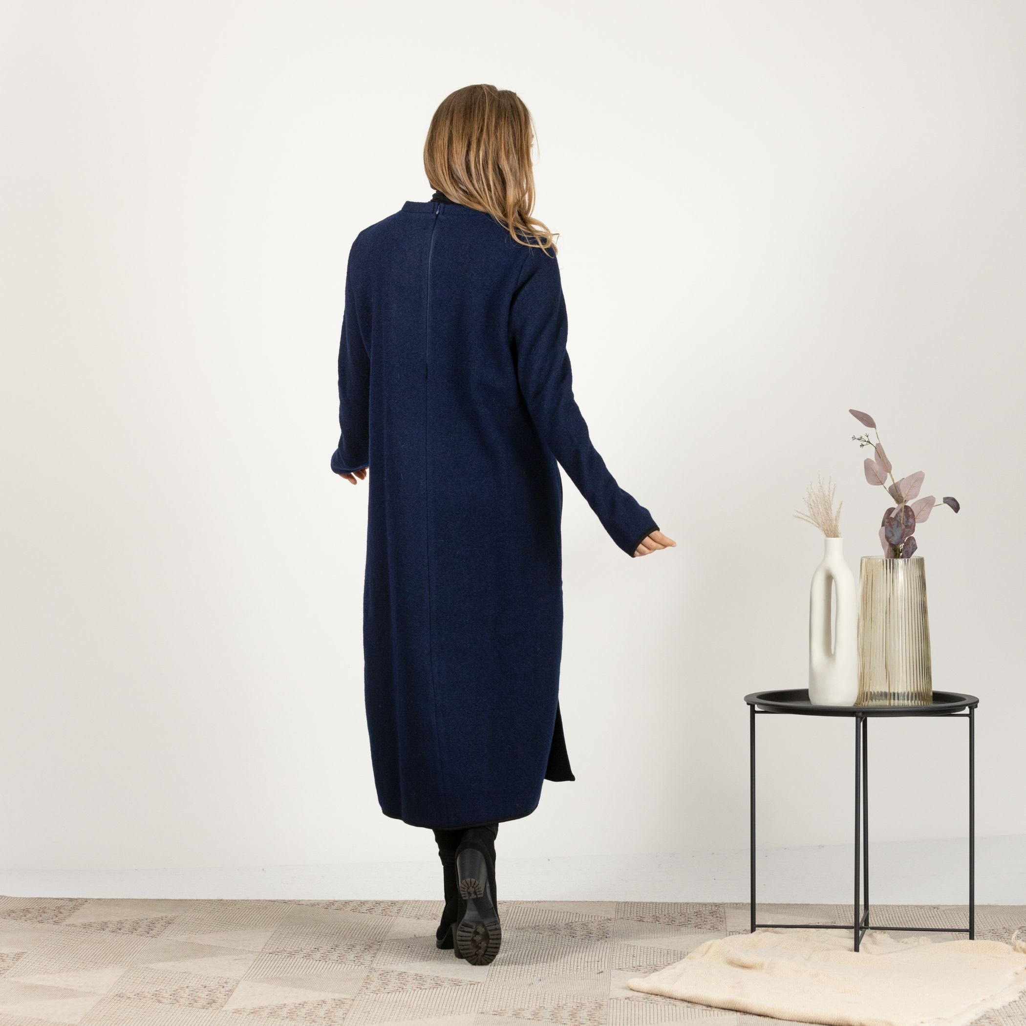 Full-length back view of the Dark Blue Wool Winter Sweater Dress, highlighting the mid-calf length and the clean, minimalist lines.