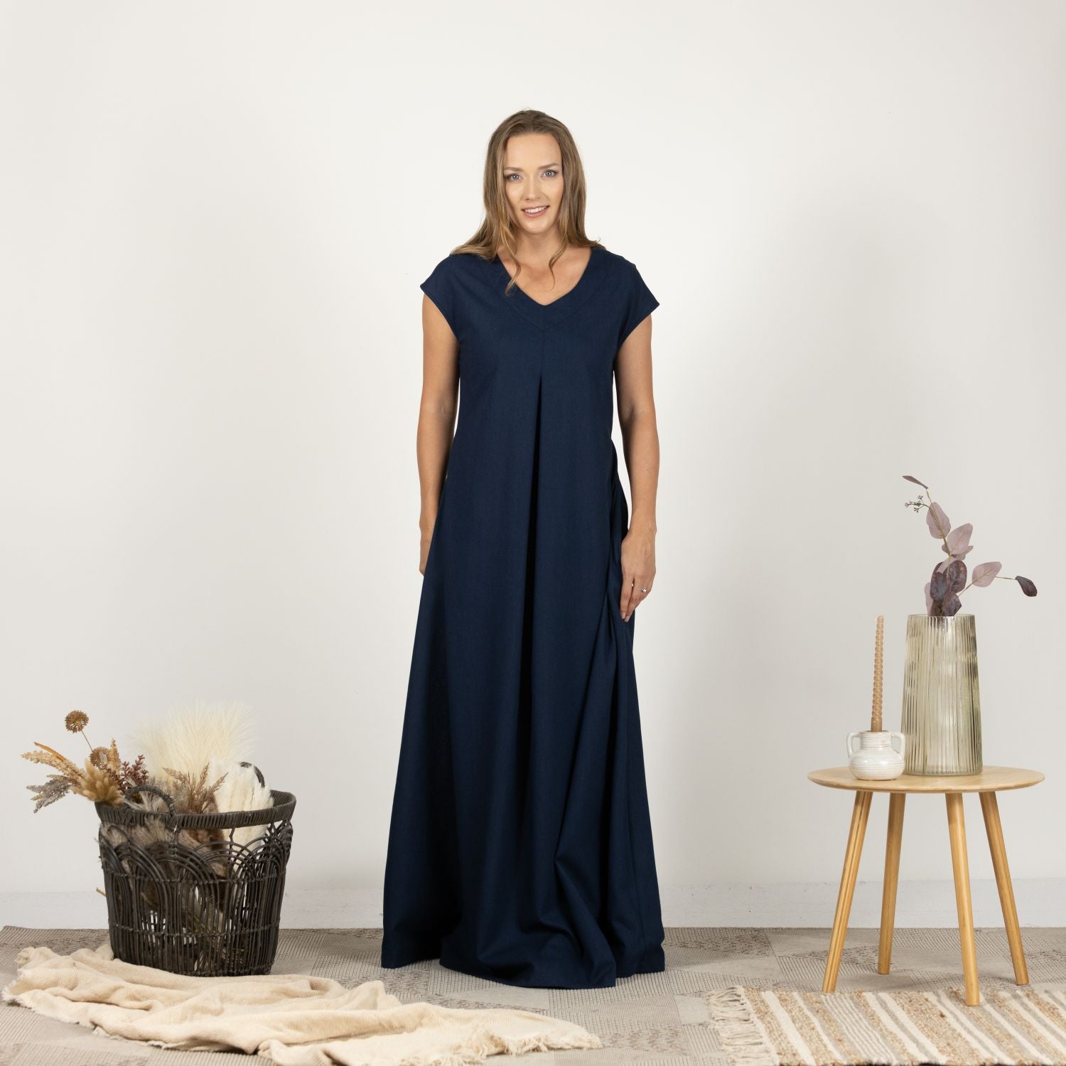 Model in the front view of the Linen Loose Dress with Back Tie, highlighting the simple and elegant style.