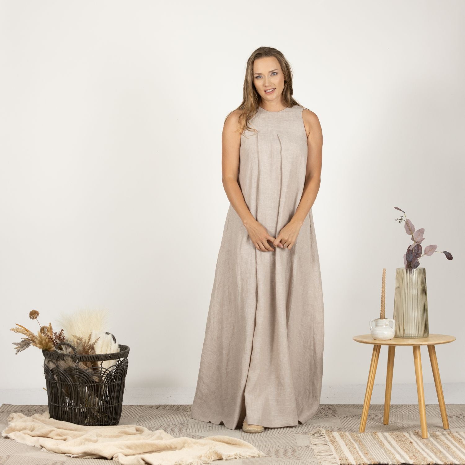 Front view of the Loose Linen Maxi Dress in Natural, featuring a relaxed trapeze silhouette and lightweight fabric, perfect for warm weather.