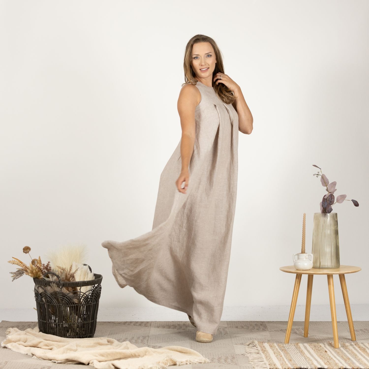 Full-length front view of the Loose Linen Maxi Dress in Natural, displaying the elegant trapeze silhouette and comfortable, airy linen fabric.