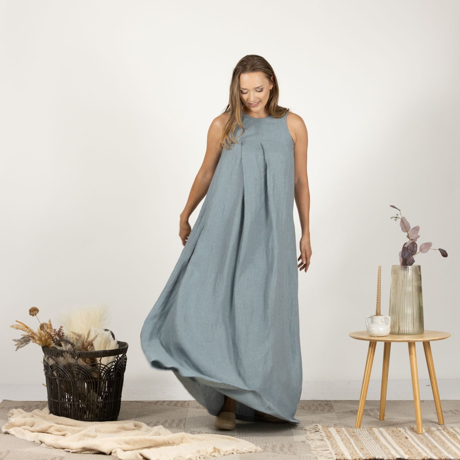 Detailed front view of the Loose Linen Maxi Dress in Dusty Blue, highlighting the relaxed fit and subtle texture of the breathable linen material.