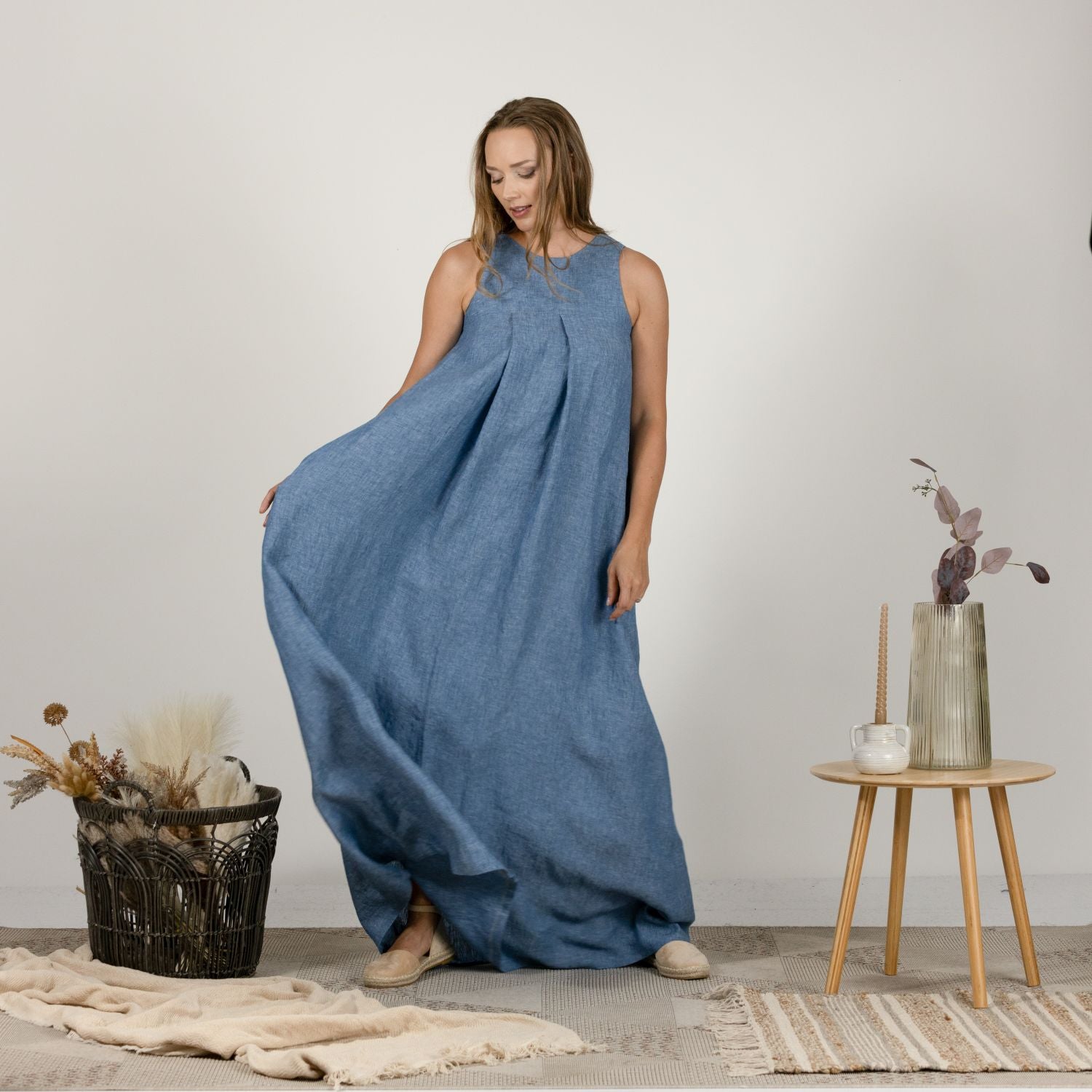 Front view of the Loose Linen Maxi Dress in Blue Melange, featuring a relaxed trapeze silhouette and lightweight fabric, perfect for warm weather