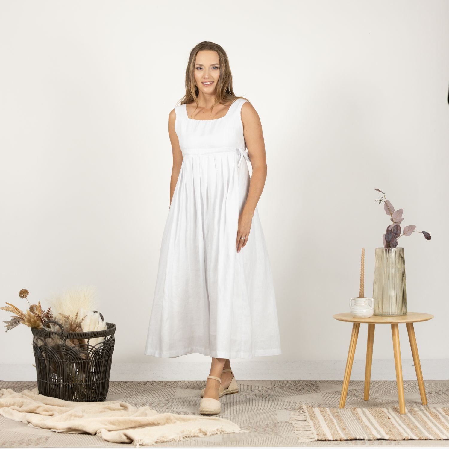 Model in the front view of the Timeless Linen Summer Dress with wide straps, highlighting the casual and elegant summer style.