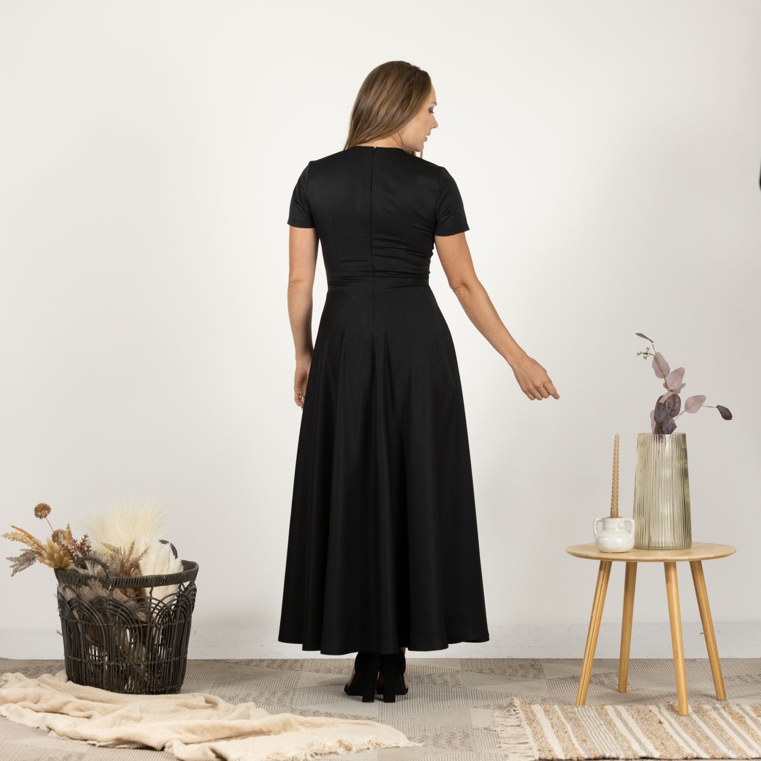 Back view of model in the Short Sleeve Modest Summer Dress, showing the dress's full-length flow and relaxed fit.