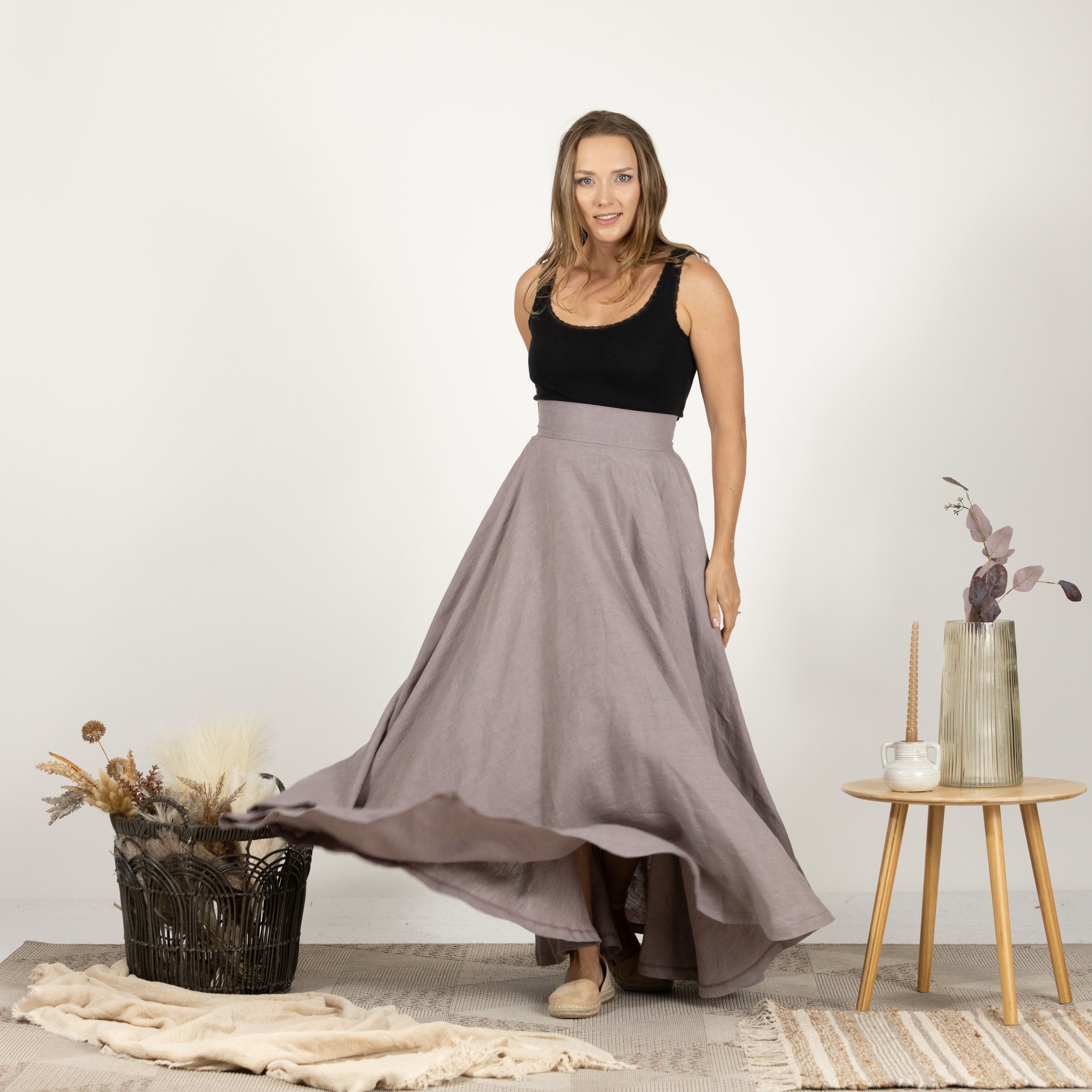 Model presenting the front of the Linen Flutter Skirt, emphasizing the high-quality linen fabric.