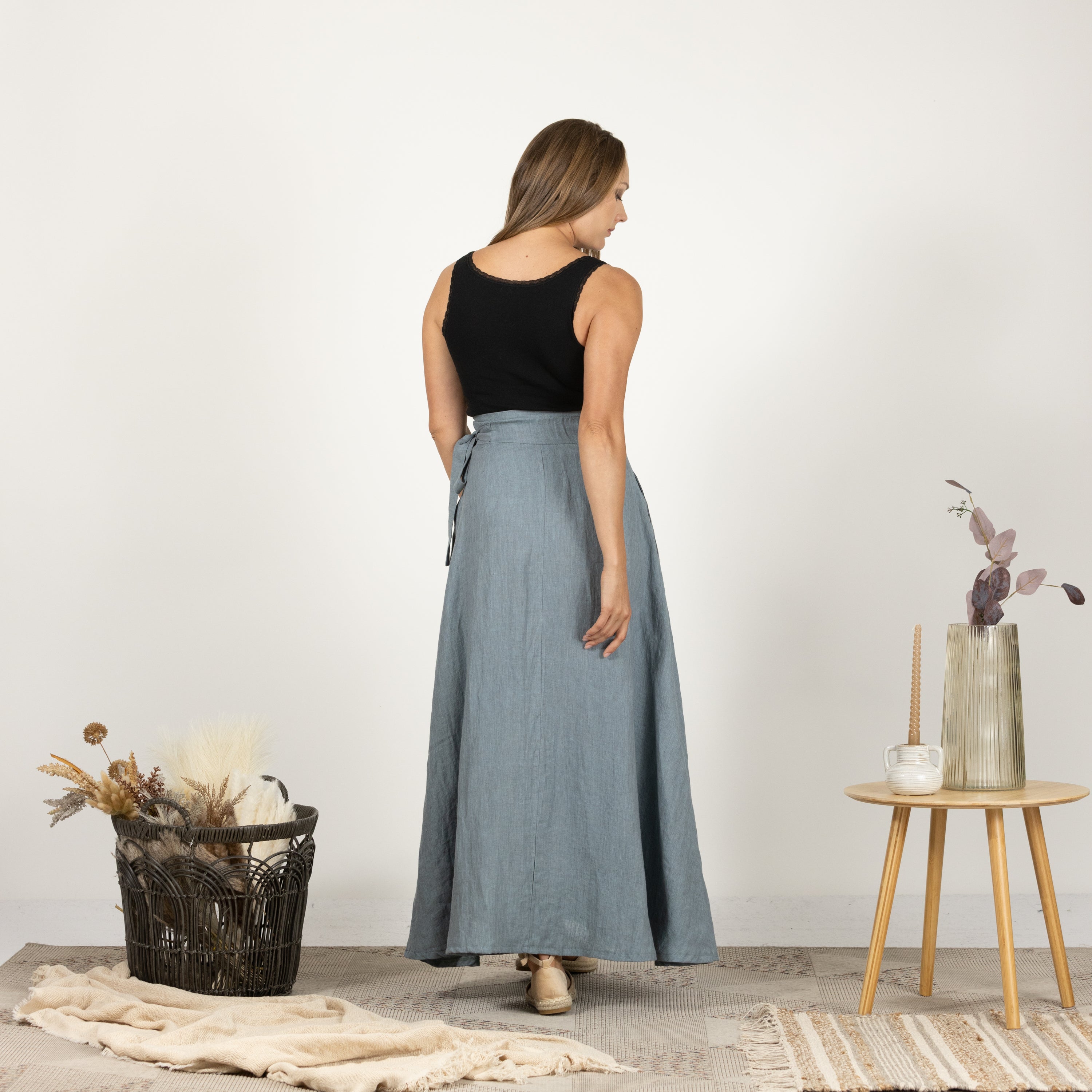 Rear perspective of the Linen Wrap Around Skirt with Tie on model, highlighting the skirt's graceful and timeless design.