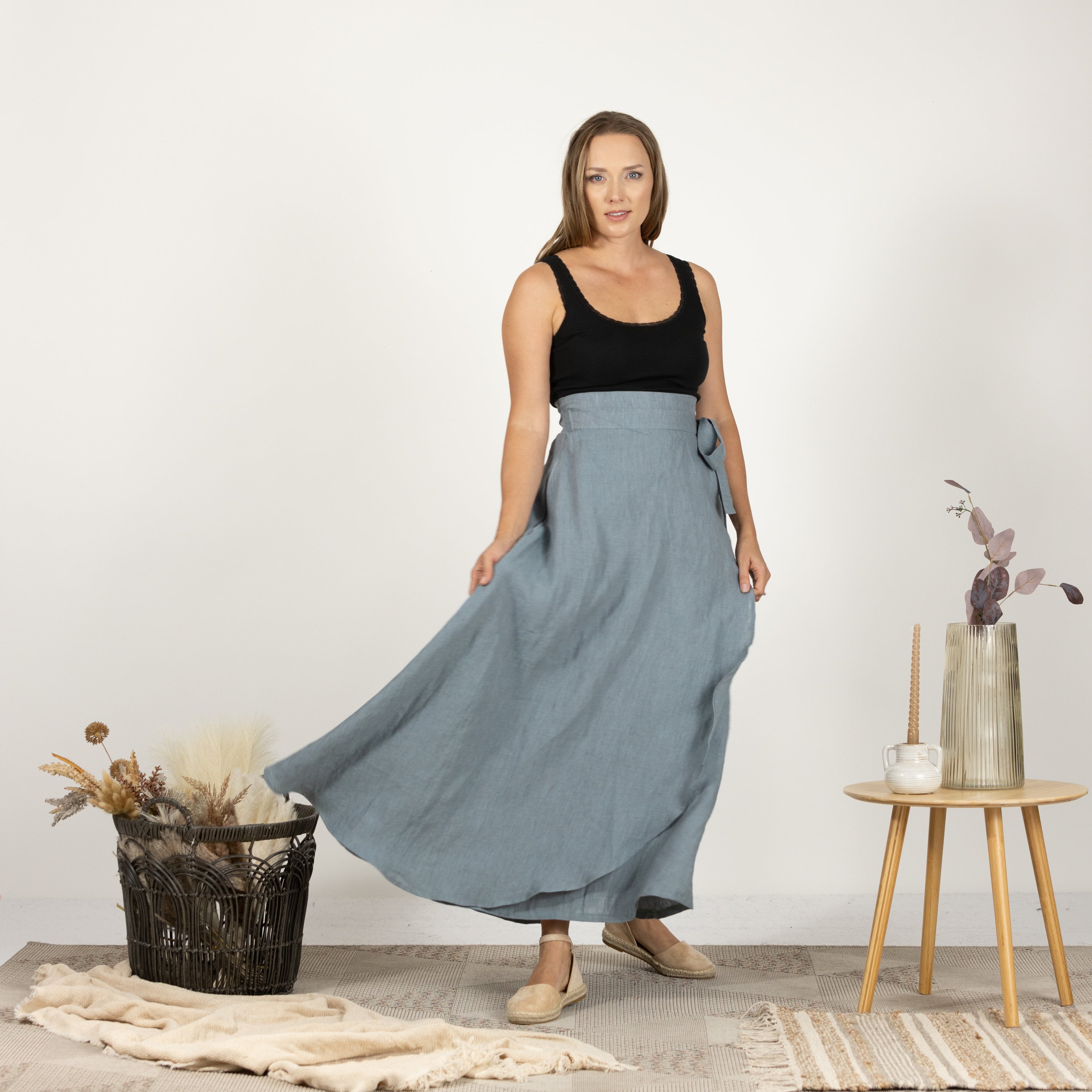 Front view of the model wearing the Linen Wrap Around Skirt with Tie, illustrating its flattering silhouette and adjustable tie design.